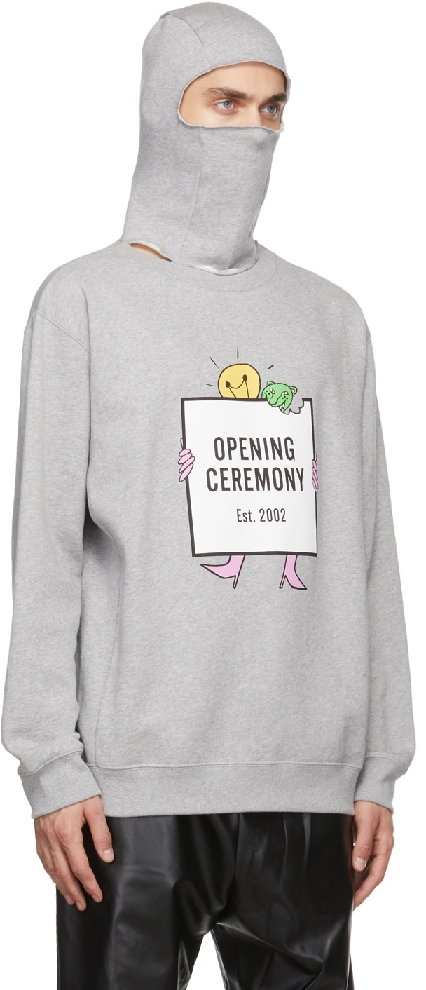 Grey hoodie showing the bulb motif against a quieter palette