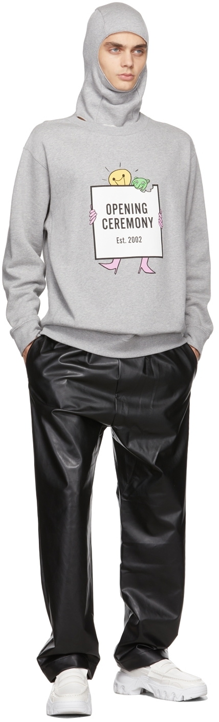 Full-length view of the grey lightbulb hoodie in relaxed proportions