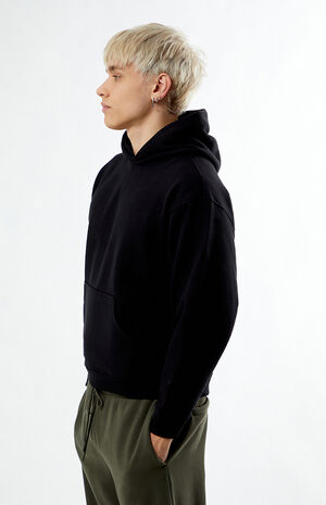 Side profile — the hood and dropped shoulder keep it relaxed.
