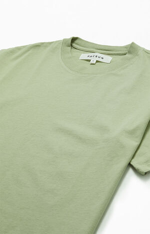 Graphic closeup — the back print reads like a location tag and founding note.