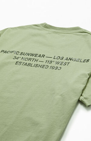 Shoulder-and-back crop — the vintage-wash finish softens the green.