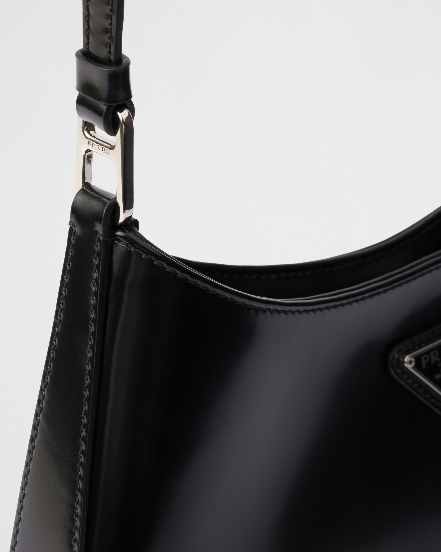 Detail of the strap hardware and polished brushed-leather finish