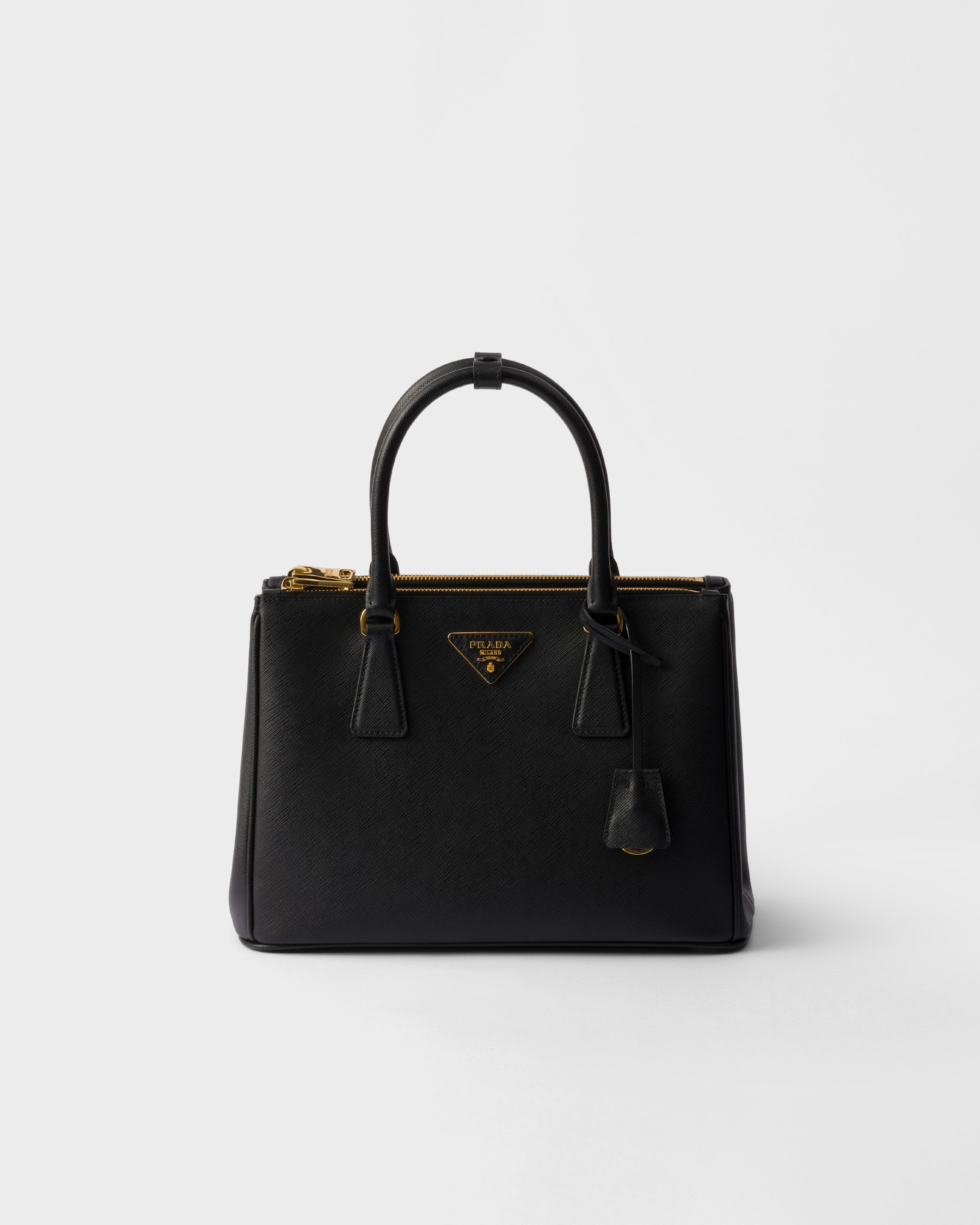 Front-on — slim top handles and the enamel triangle plaque