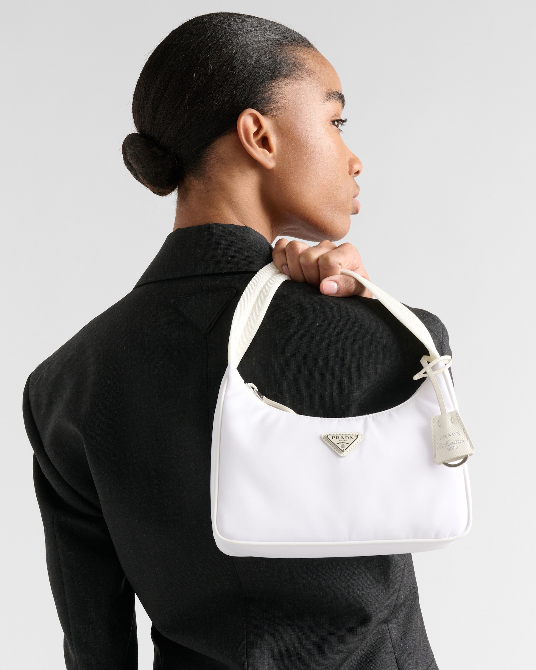 White Re-Nylon on the shoulder — the minimal, lightweight carry