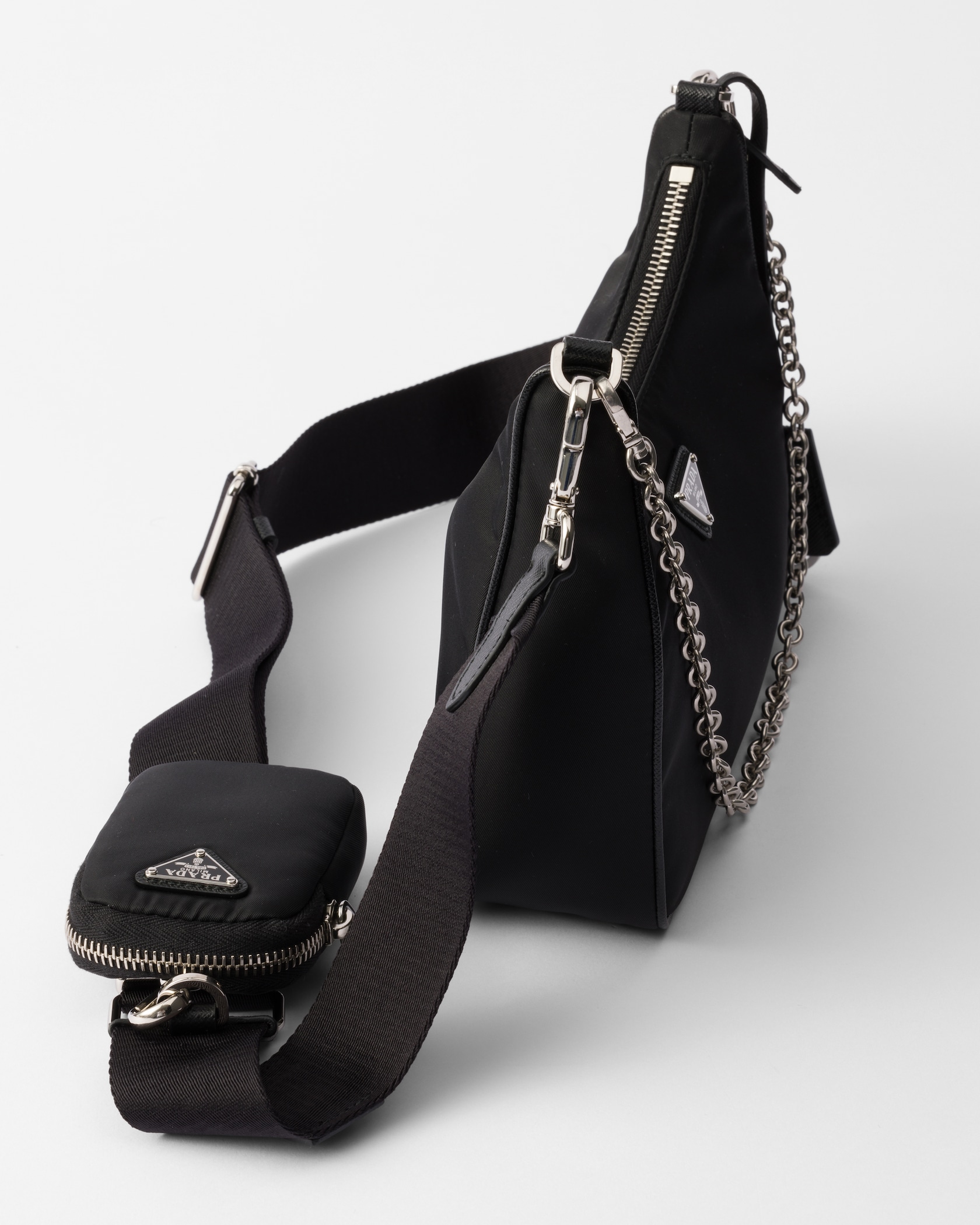 Detail of the chain strap, mini pouch and adjustable woven strap