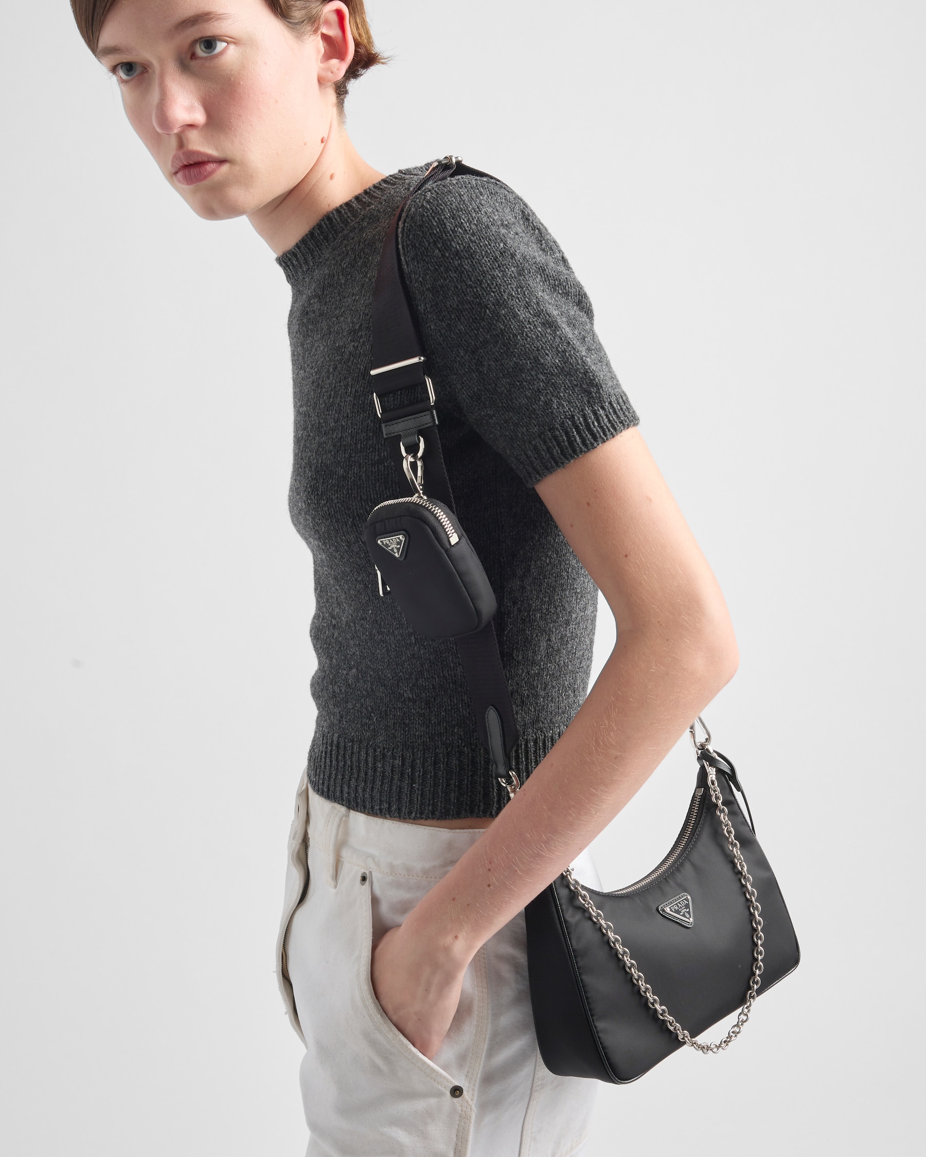 Worn cross-body on the logo-print woven strap — the everyday carry