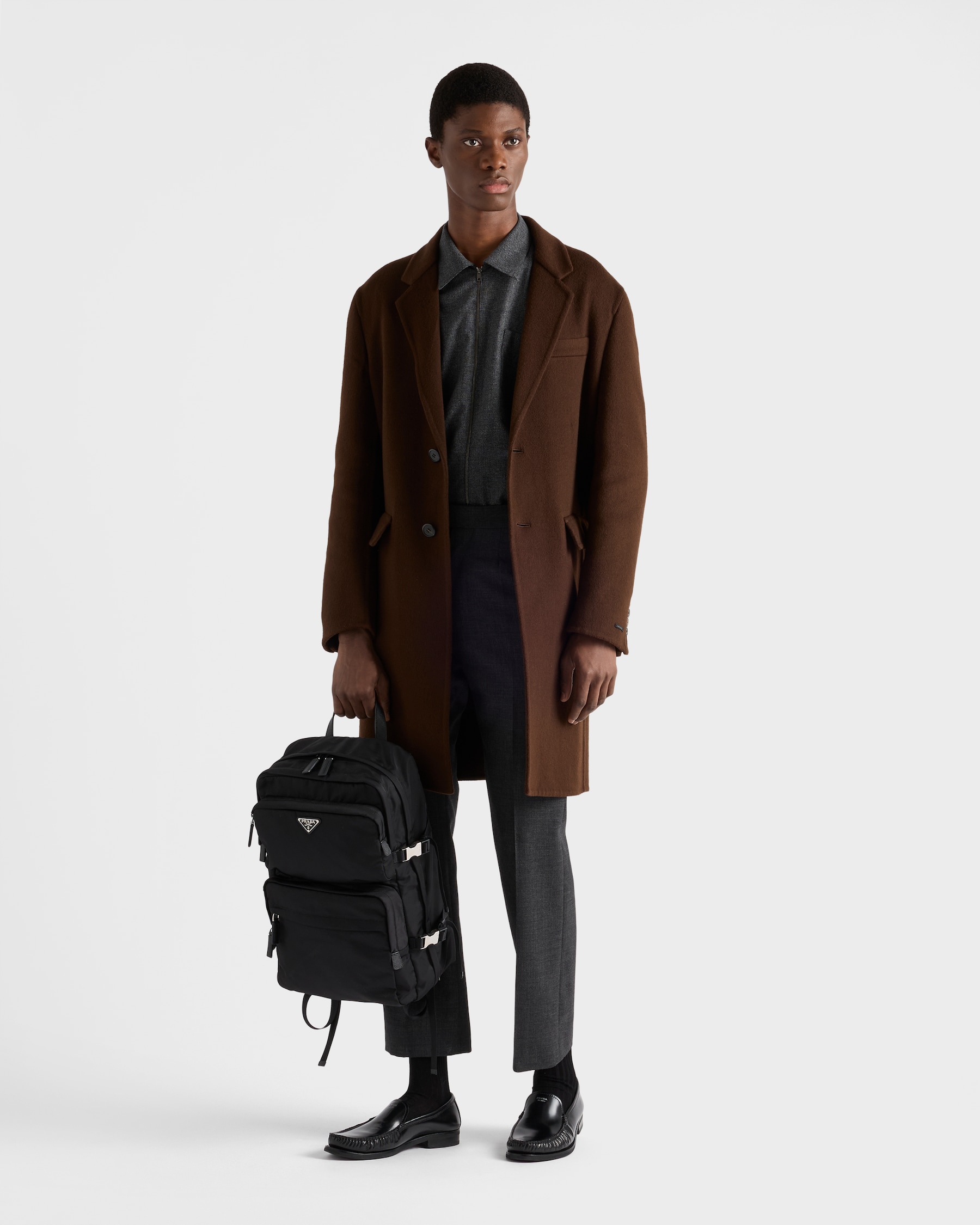 Worn carry — the heritage backpack under tailoring
