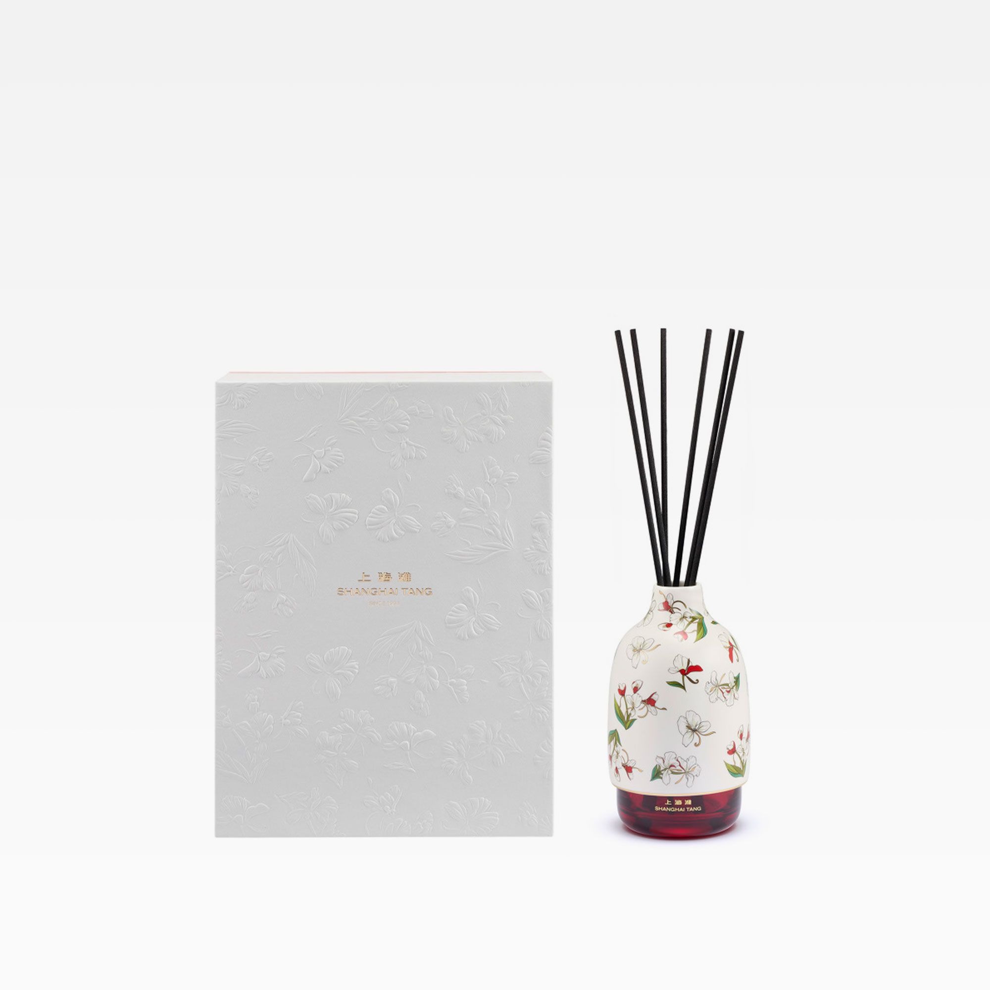 White bottle and reed diffuser