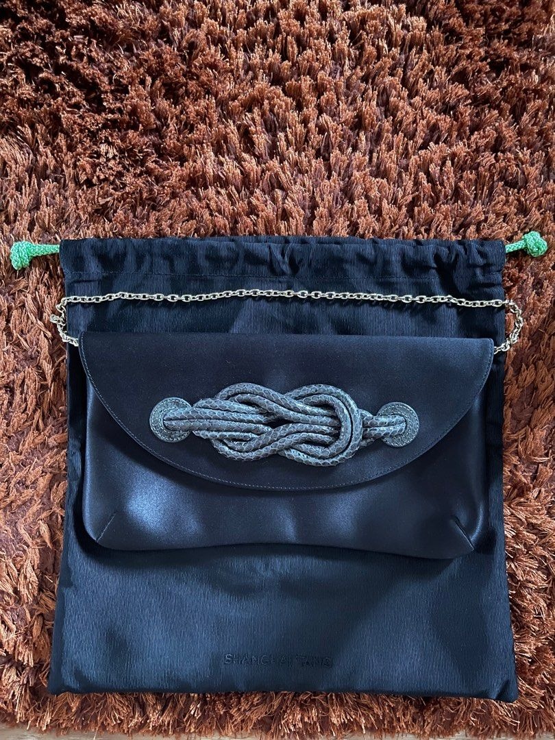 Blue clutch shown with shoulder chain