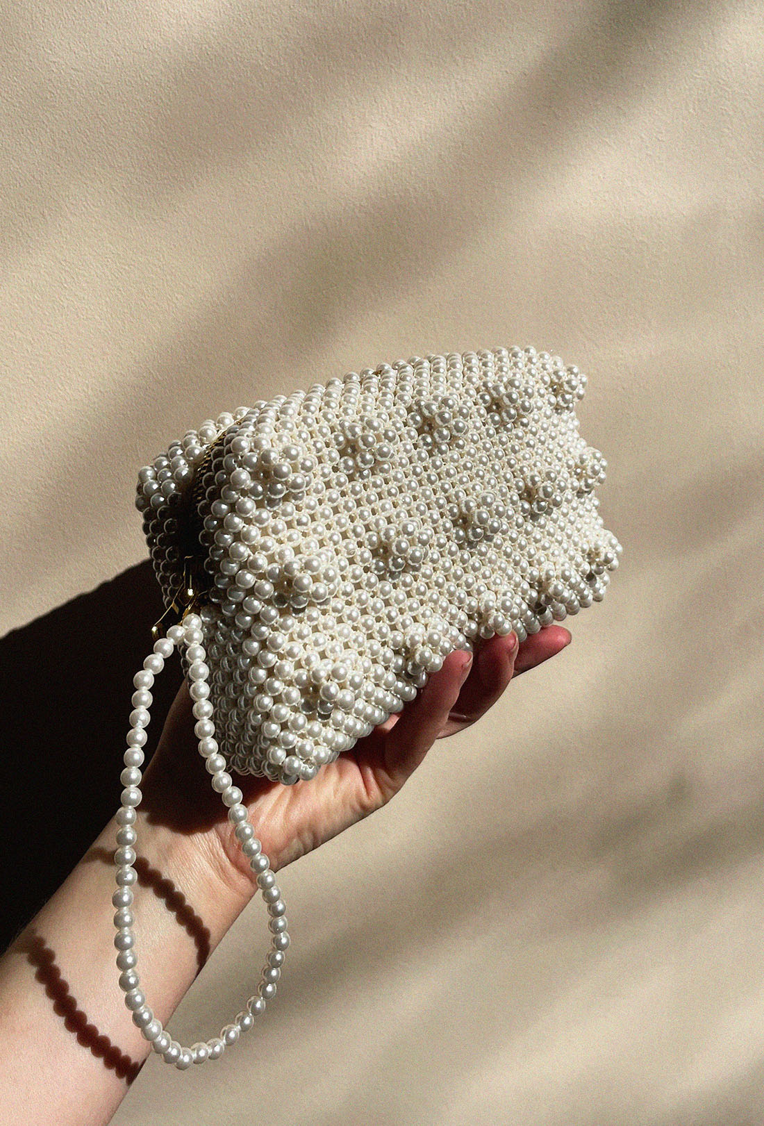 Clean cream beaded clutch view