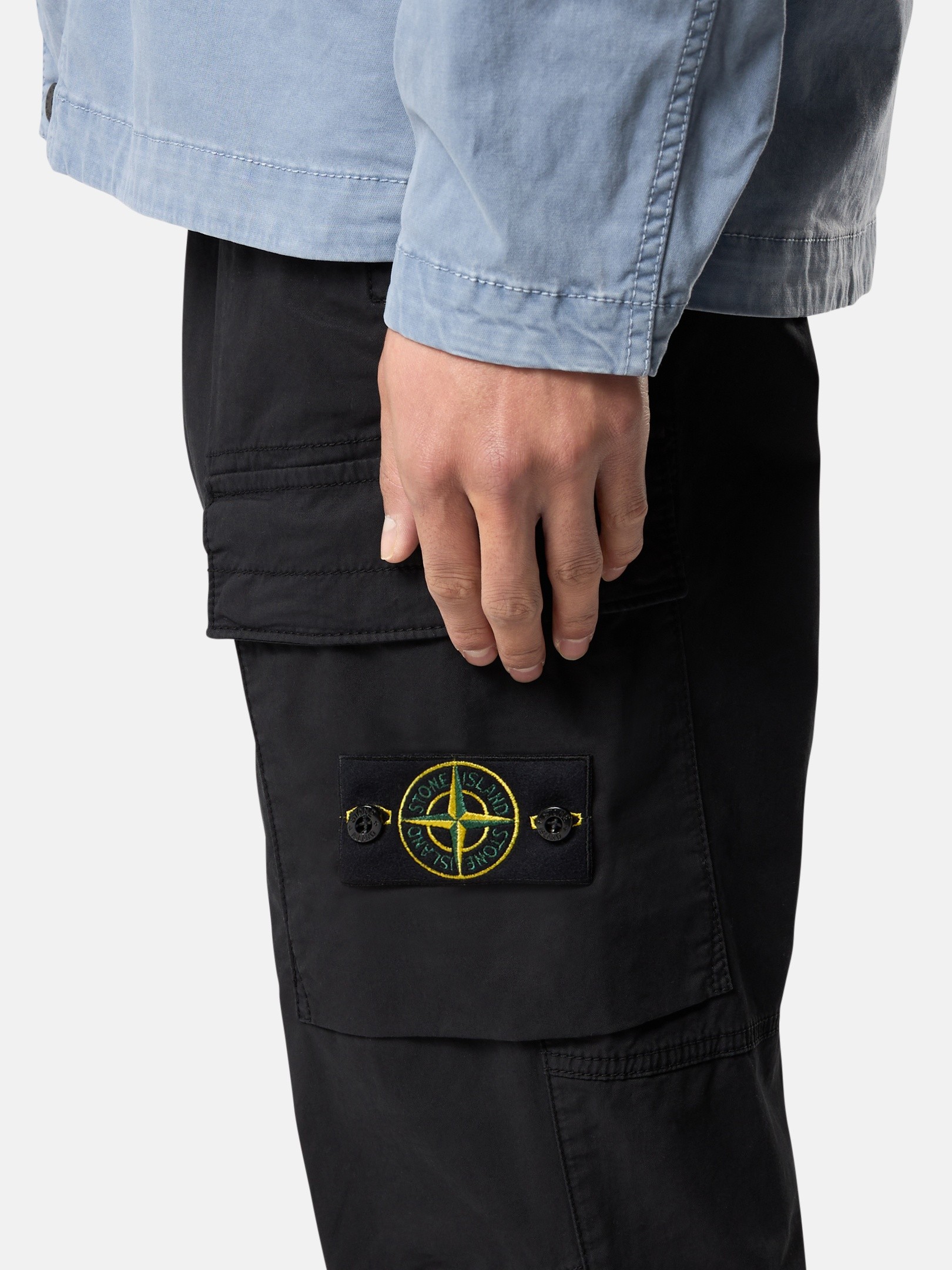 Detail — the compass badge and cargo pocket