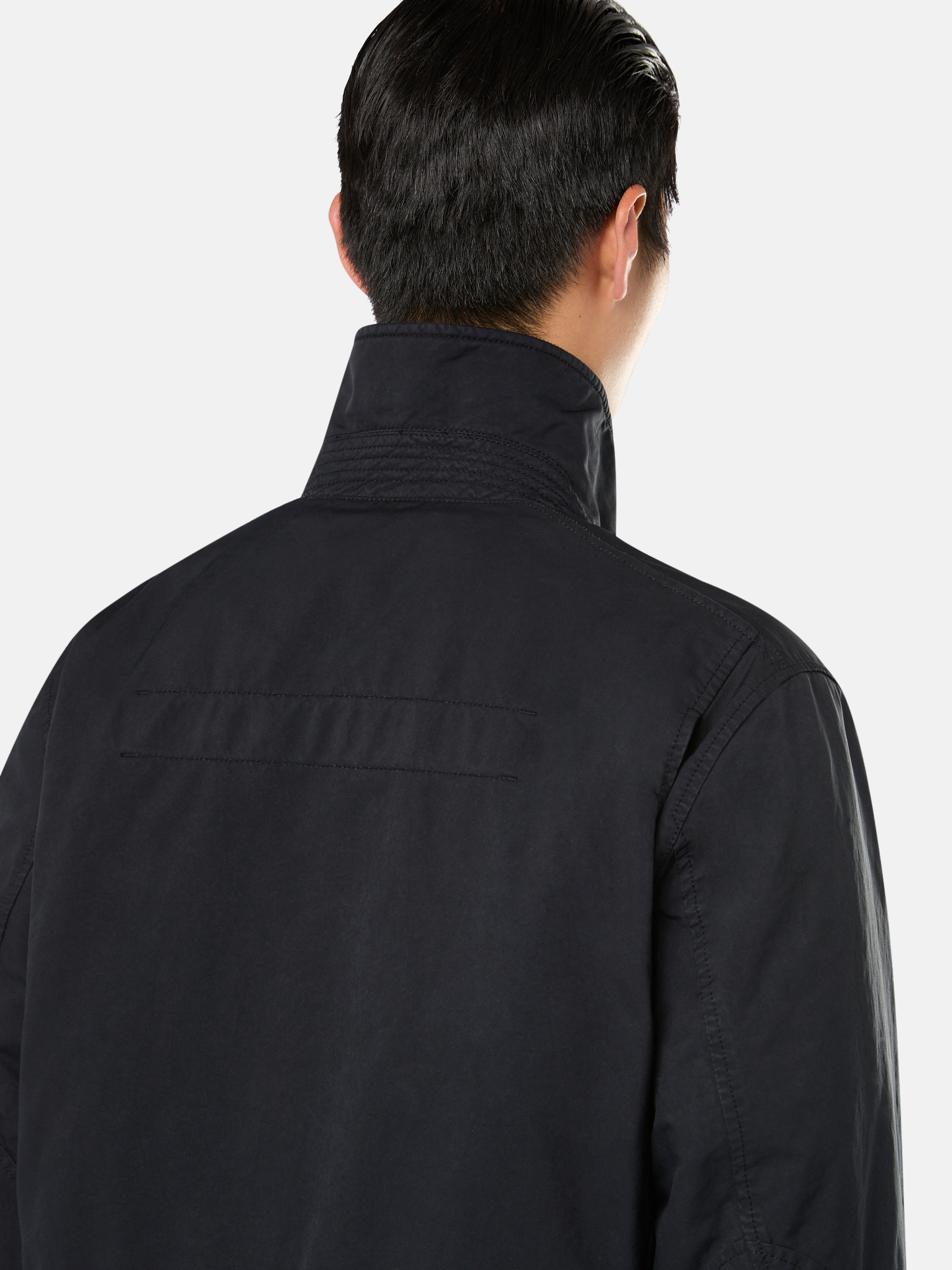 Detail — the concealed hood zip and front placket