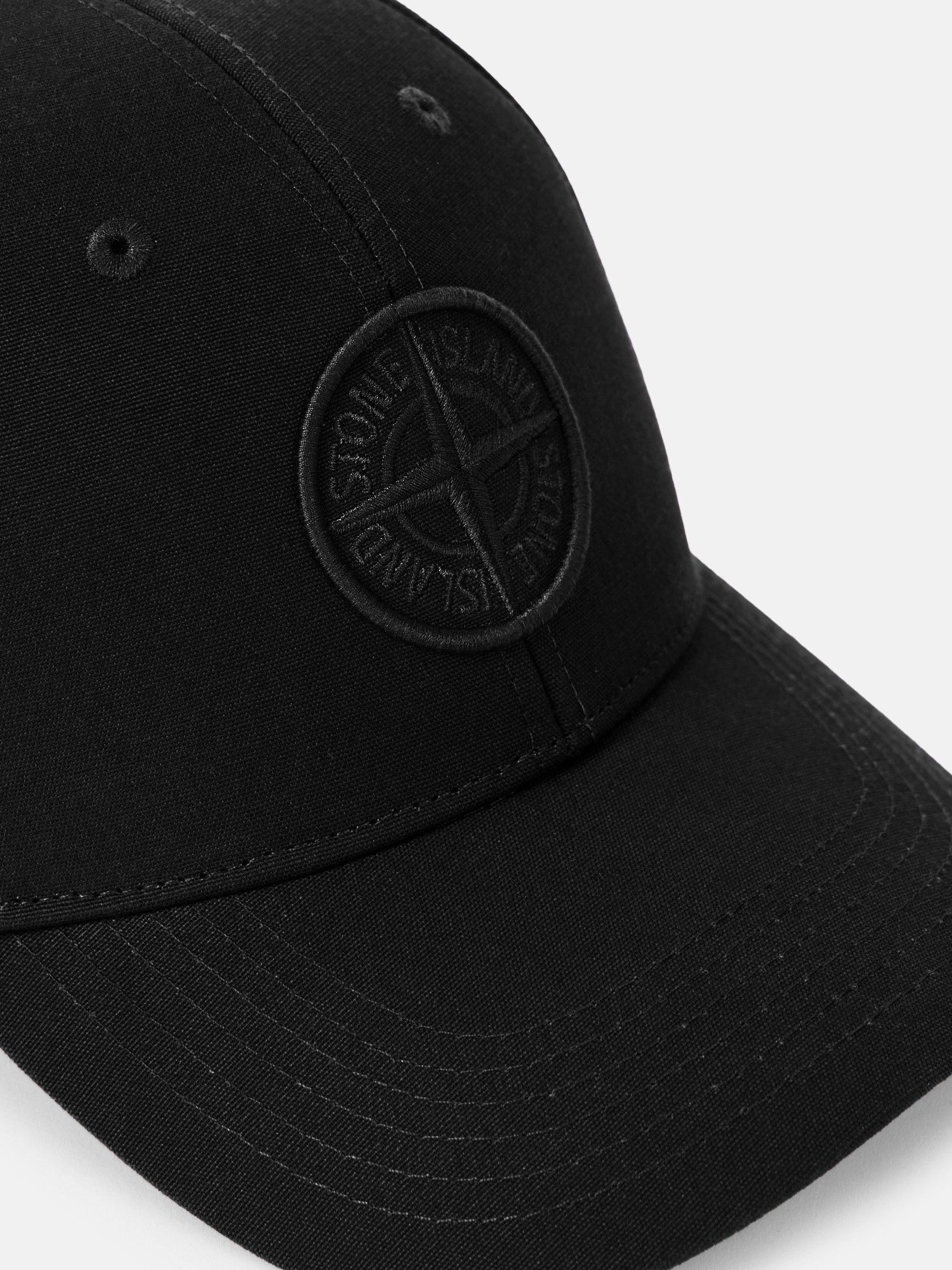 Detail — the embroidered compass on the side panel