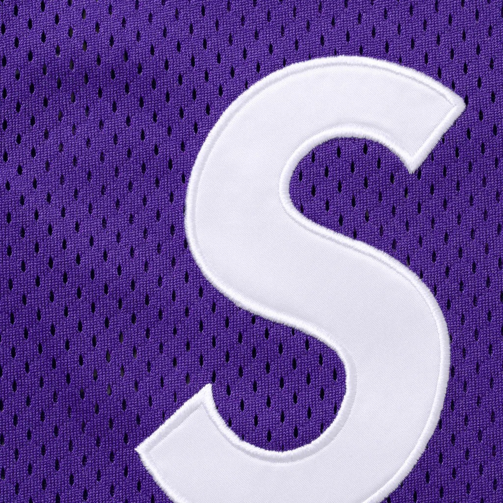 Official close-up of satin S appliqué