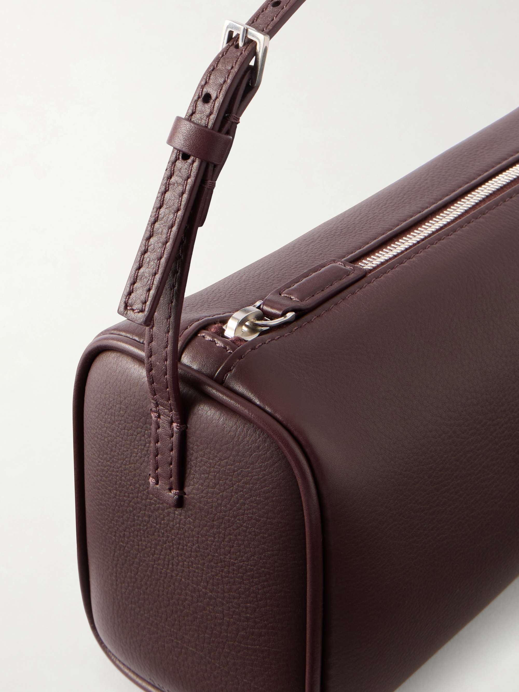 Detail of the buckle, top zip and grained calfskin
