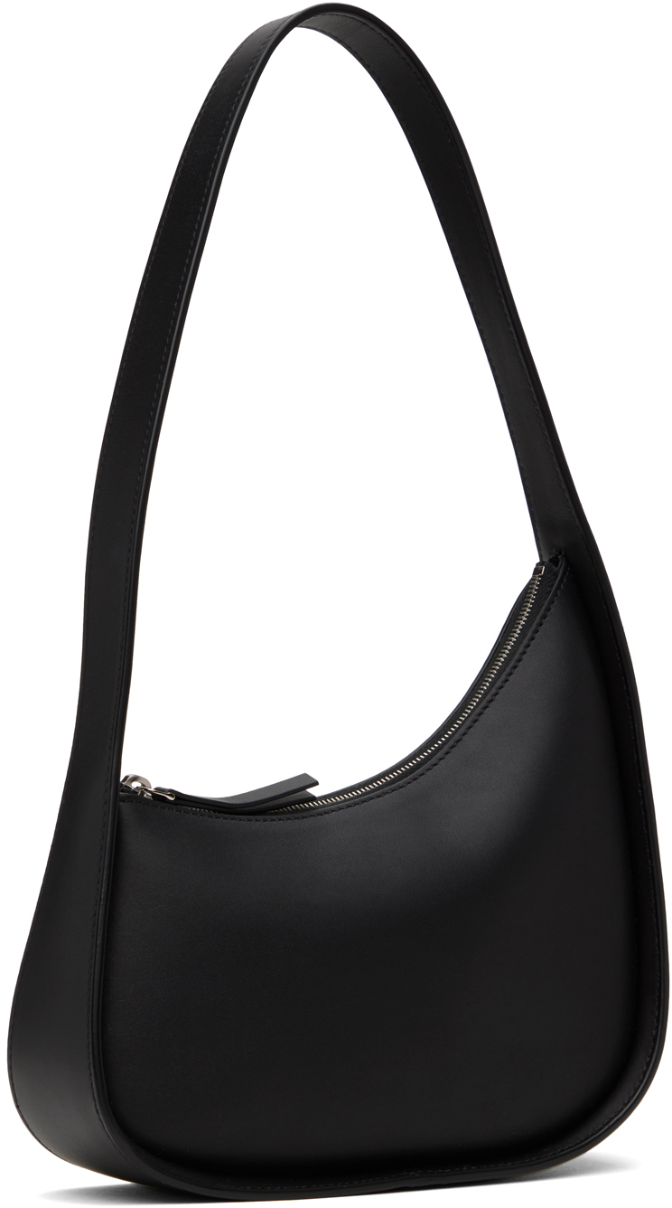 Three-quarter view showing the curved top zip