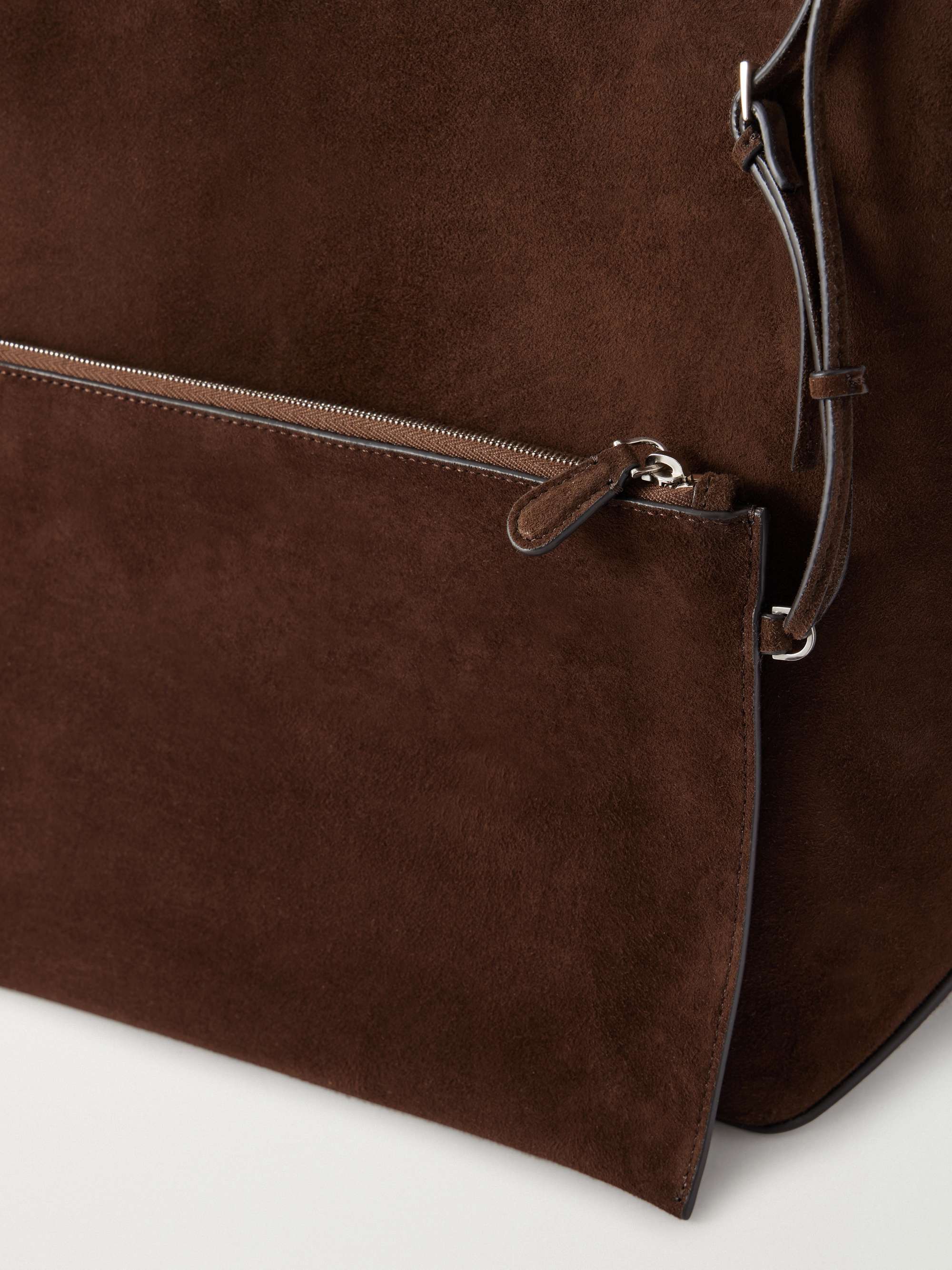 Detail of the strap knot and leather-trimmed edge