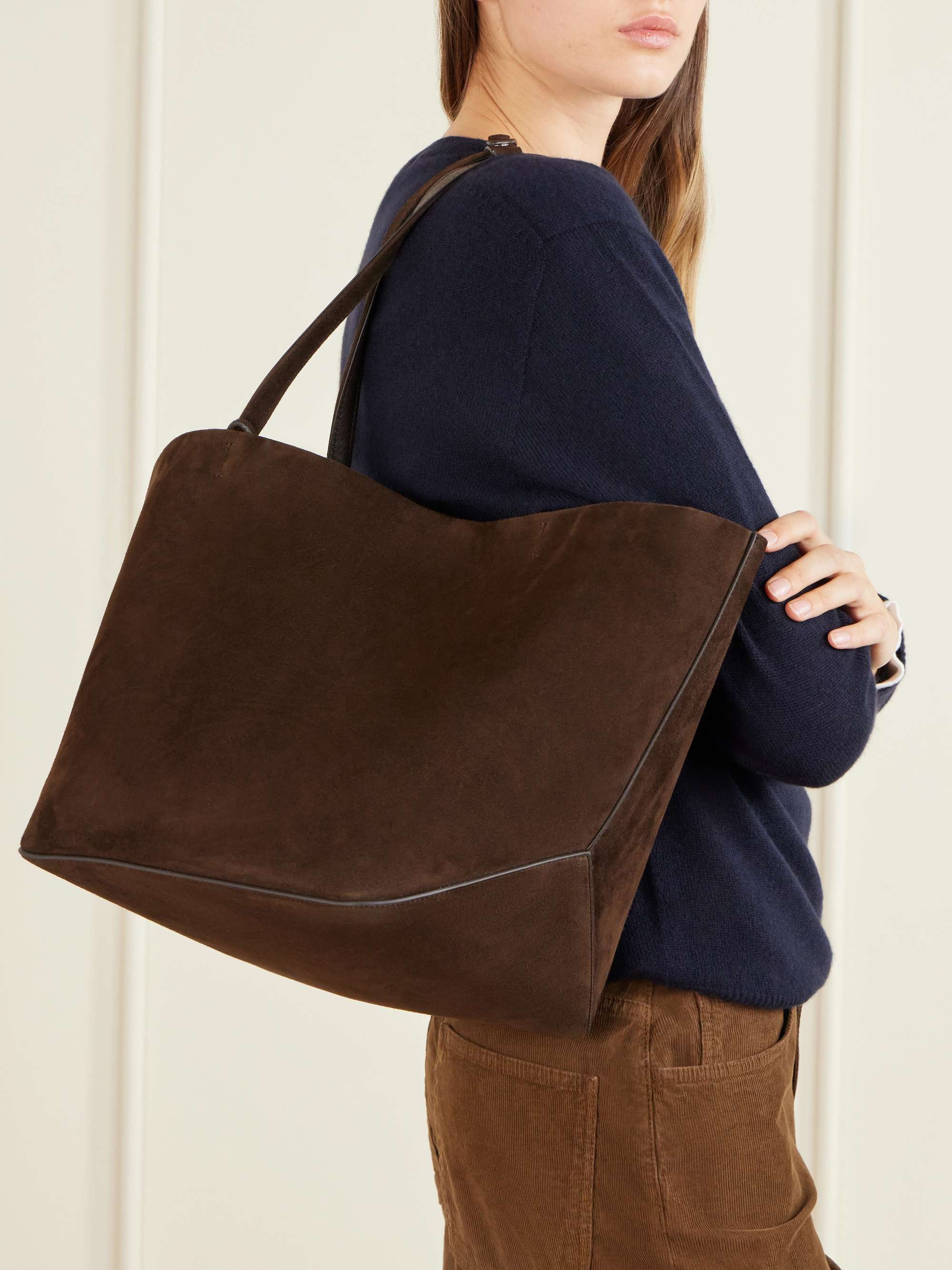 Three-quarter view showing the open-top tote shape