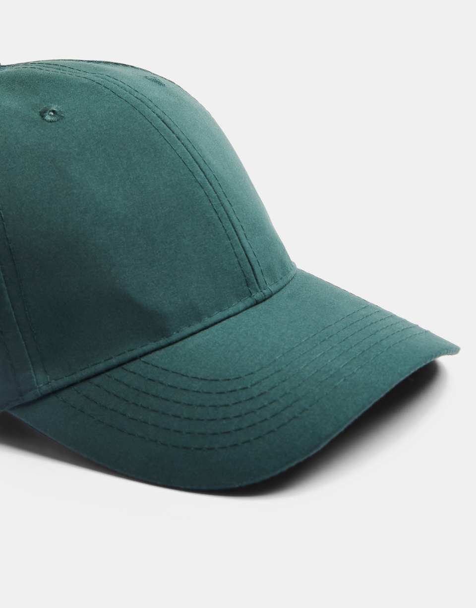 Curved peak