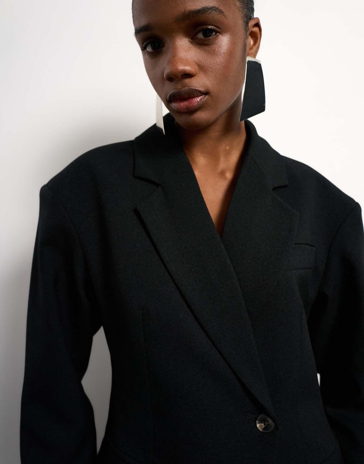 Close-up on the lapels and padded shoulders