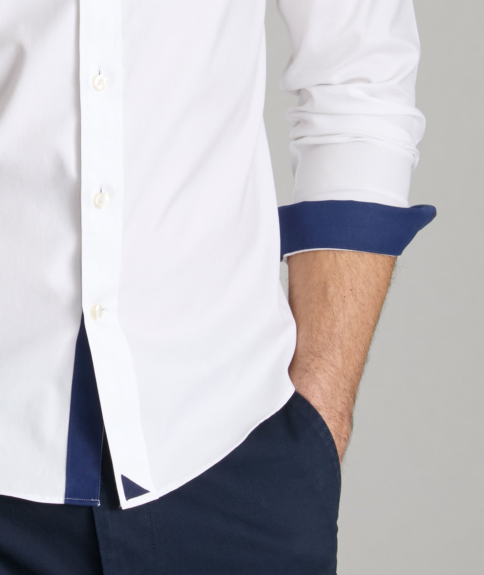 Navy cuff and button stitching accents