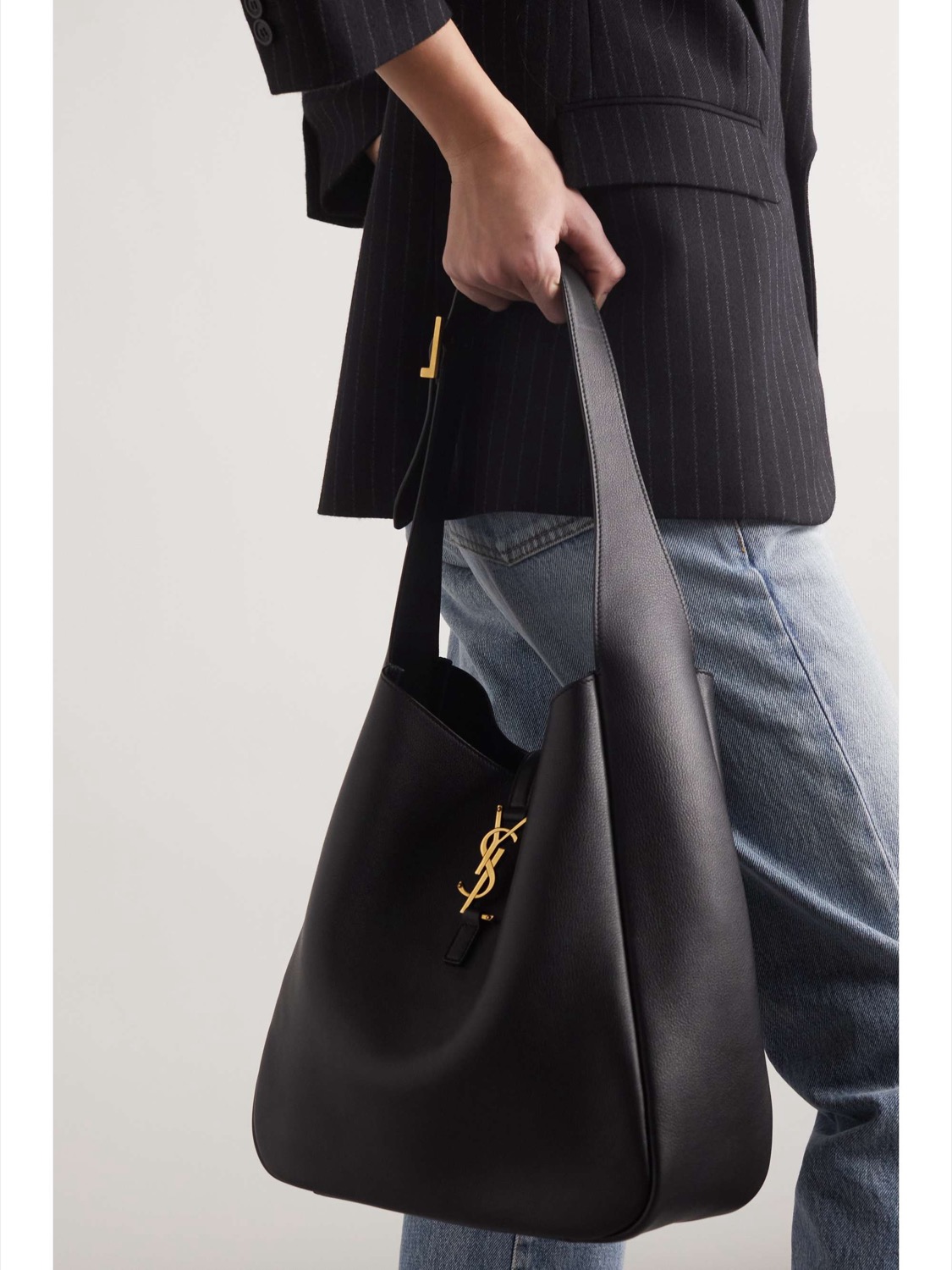 Carried on the shoulder — the slim, slouchy daytime line