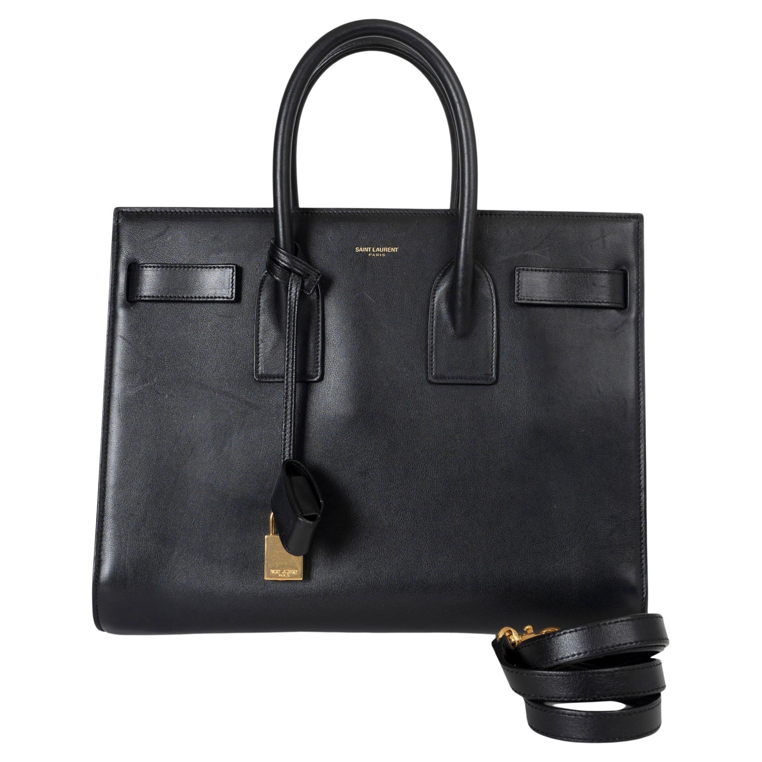 Front view with the detachable crossbody strap and gold padlock
