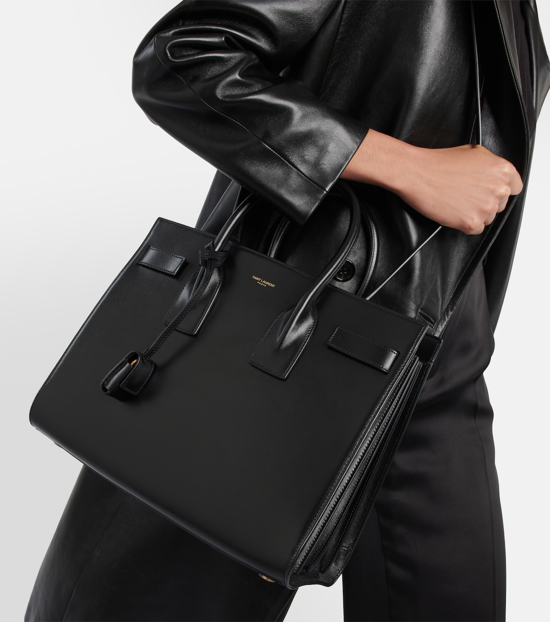 Carried in the crook of the arm — the everyday work proportion