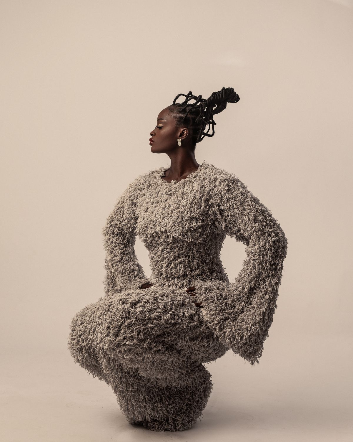 Sculptural couture look in profile