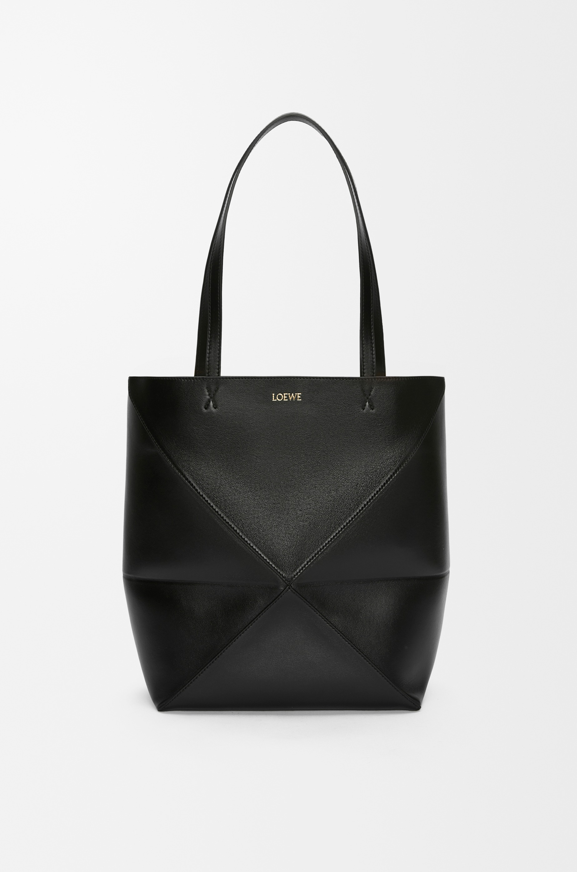 Loewe Medium Puzzle Fold tote in black shiny calfskin, official product view.