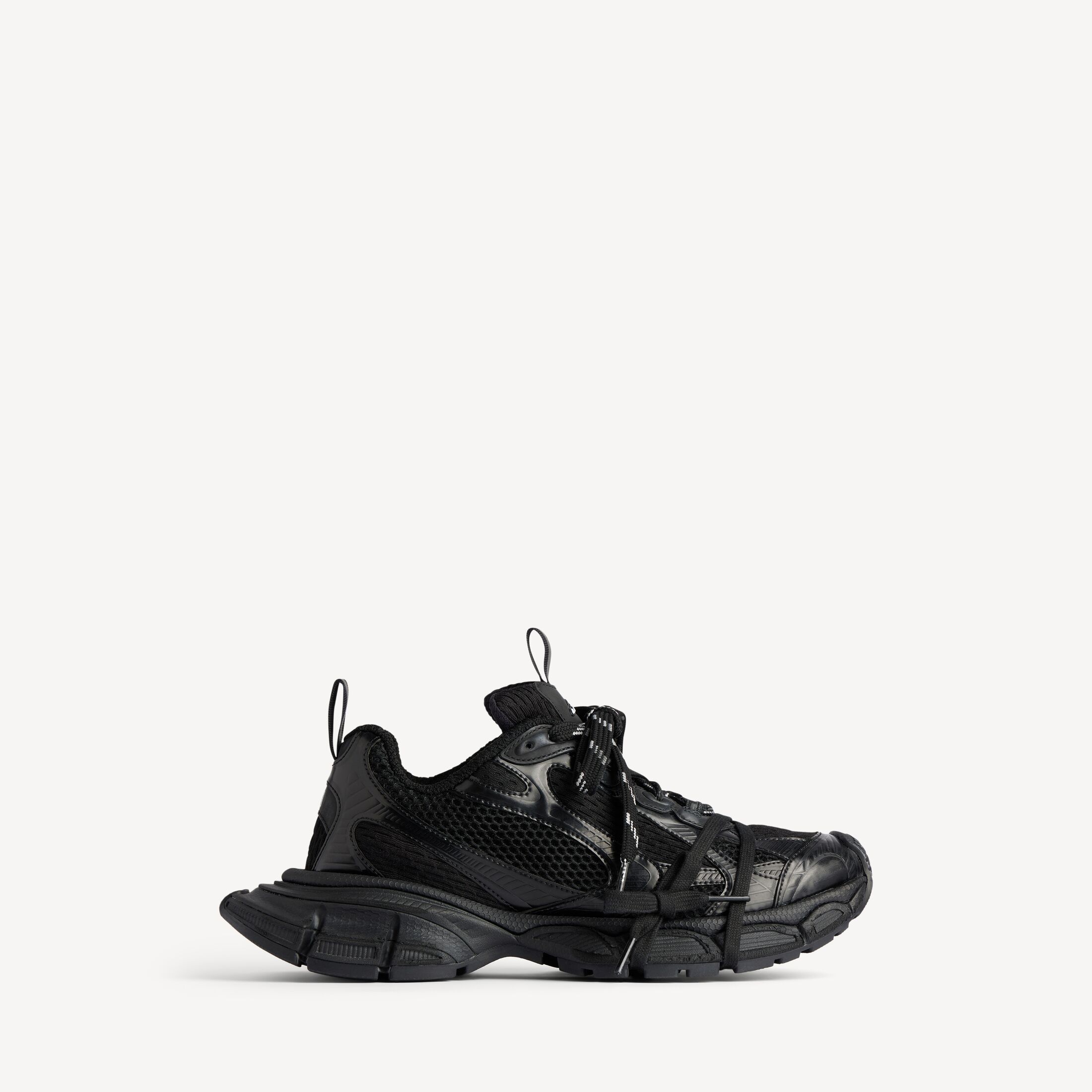 Balenciaga 3XL Sneaker in black, side view, mesh and polyurethane upper with extended laces and oversized sole visible