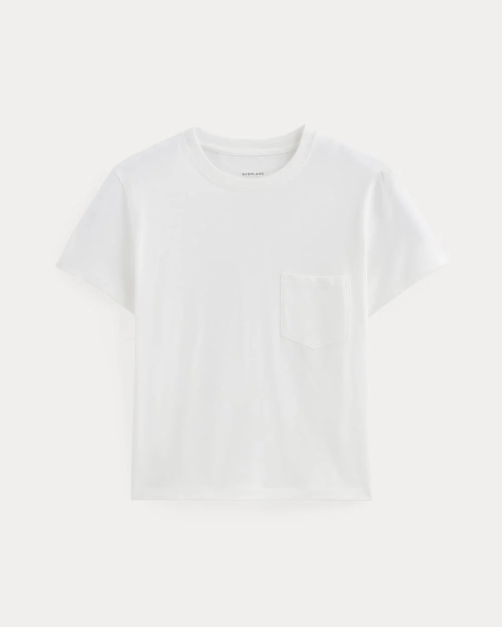 Everlane white Box-Cut Tee in Essential Cotton shown flat against an off-white background