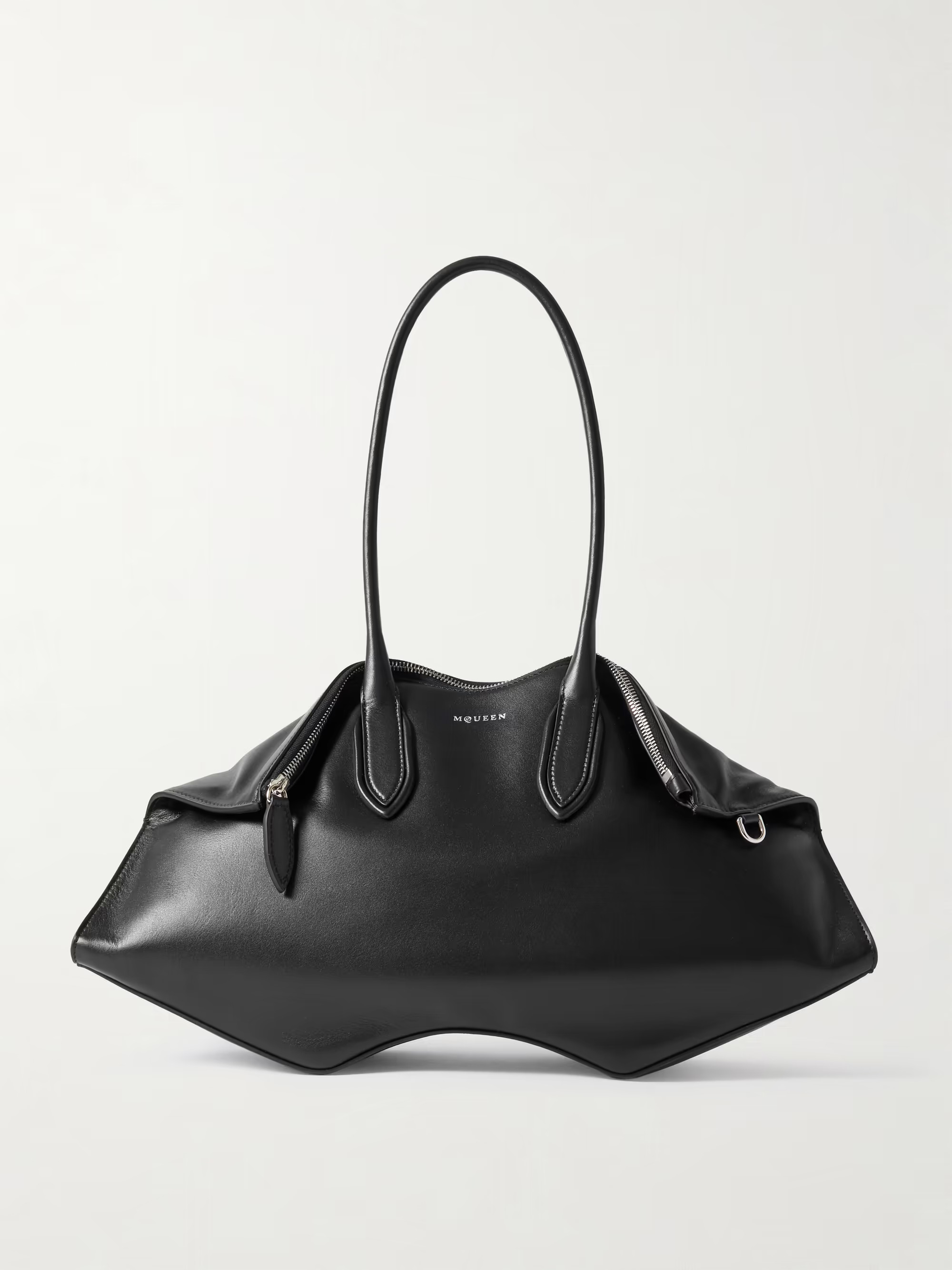 Alexander McQueen Manta Bag in black leather, front view with long tubular handles and wave-shaped base