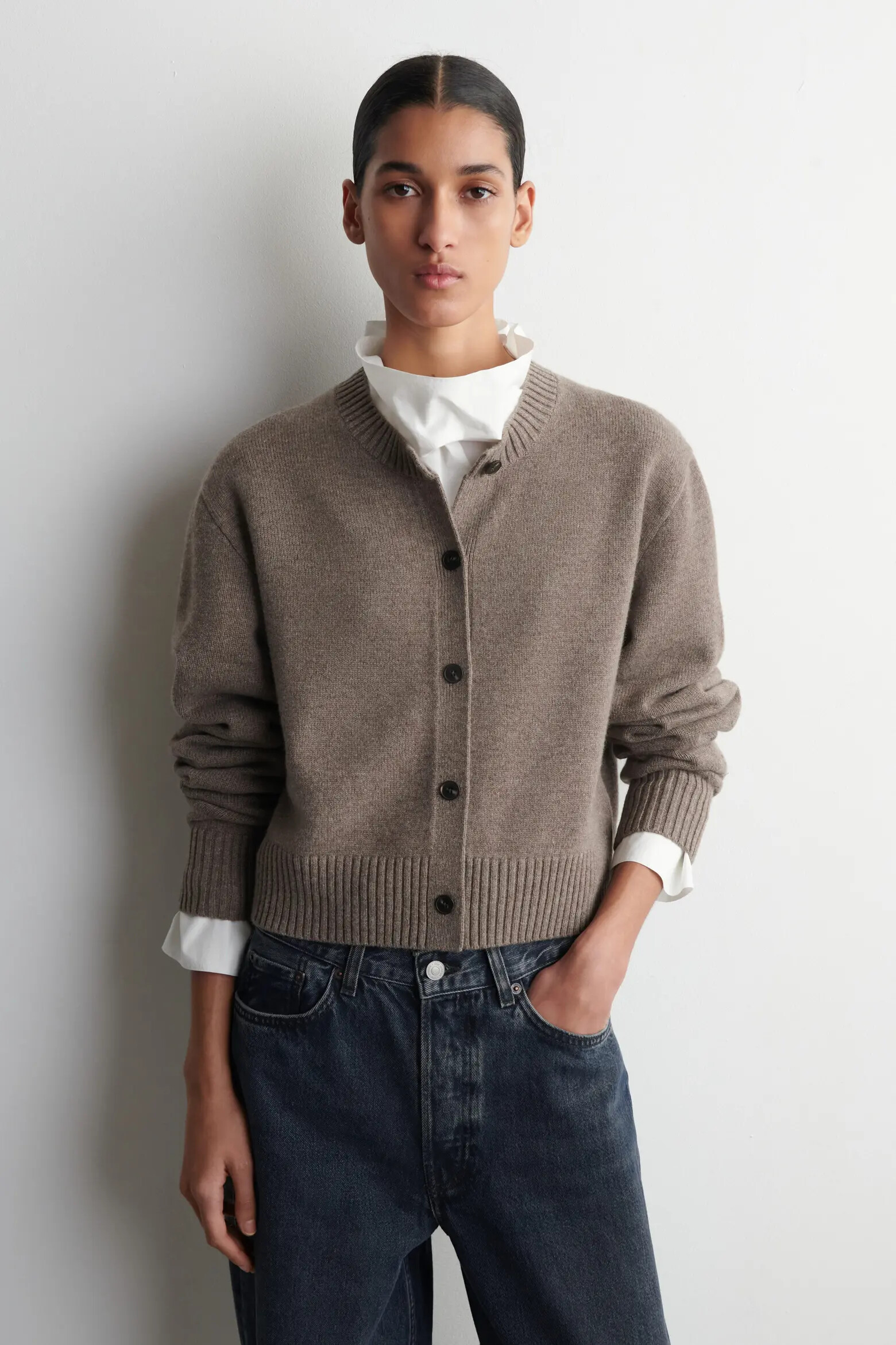 COS Beige Melange merino cardigan layered over white and dark denim