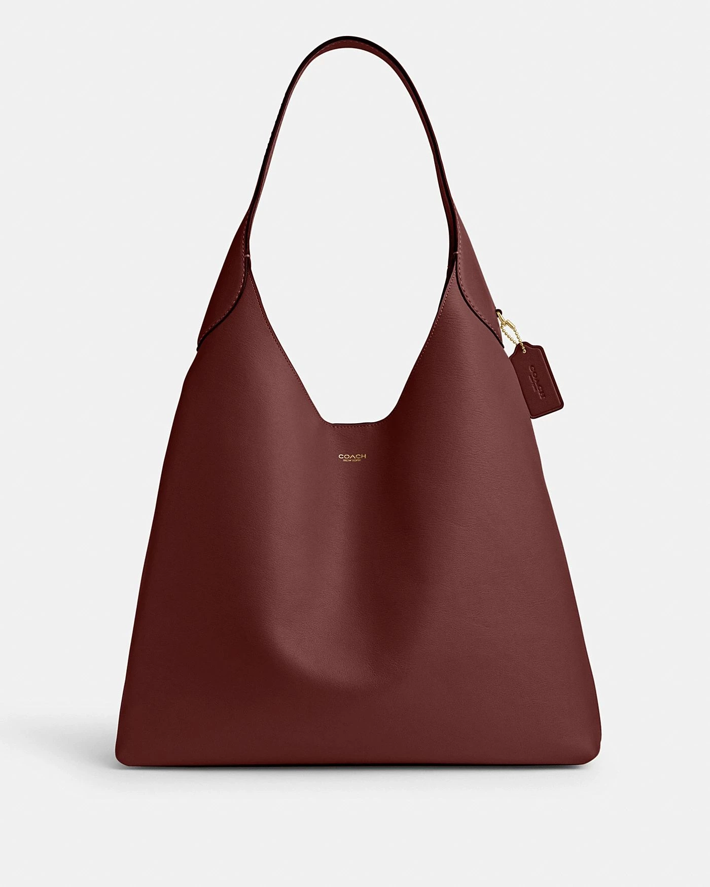 Coach Brooklyn Shoulder Bag 39 in deep burgundy leather shown upright on a pale background