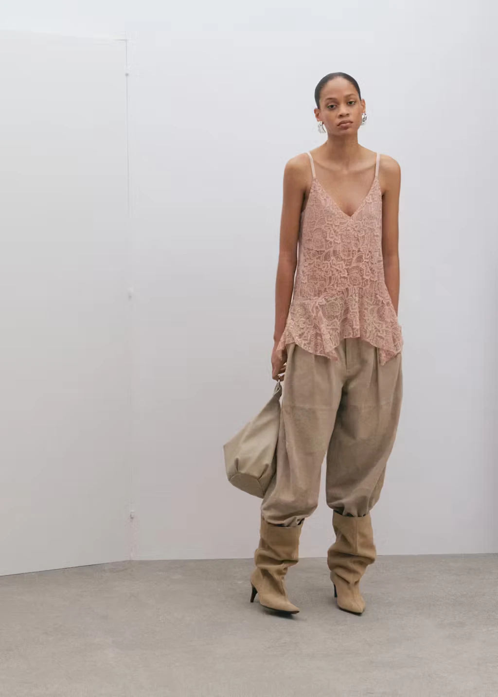 Mango pastel-pink ruffled lace top styled with neutral trousers