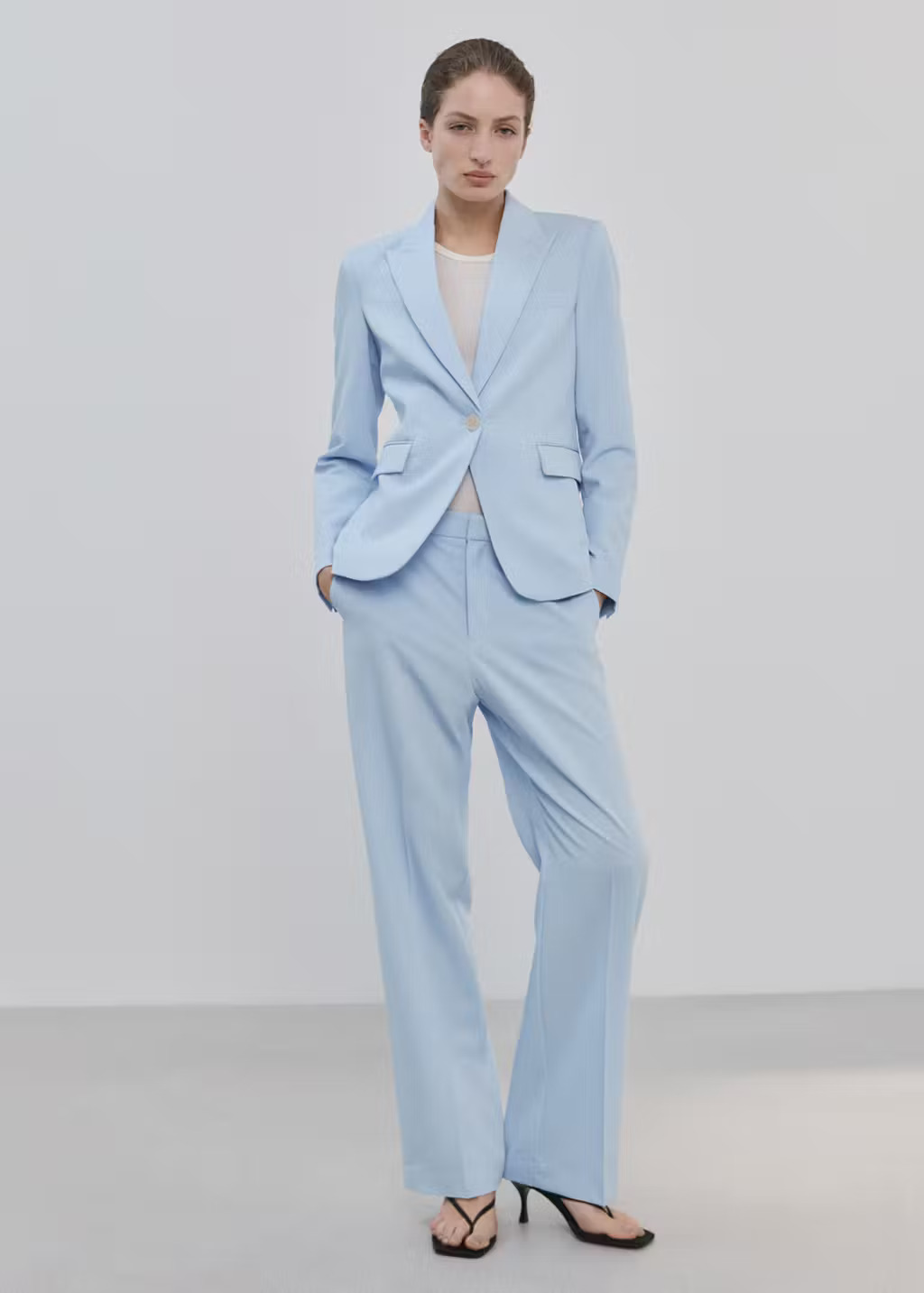Mango fitted blue suit blazer styled with matching wide-leg trousers