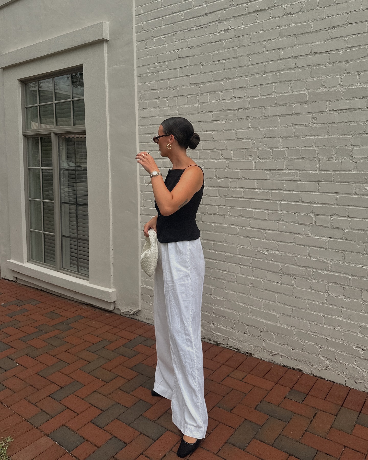 Malana Navarre in a complete black-and-white Target outfit outdoors