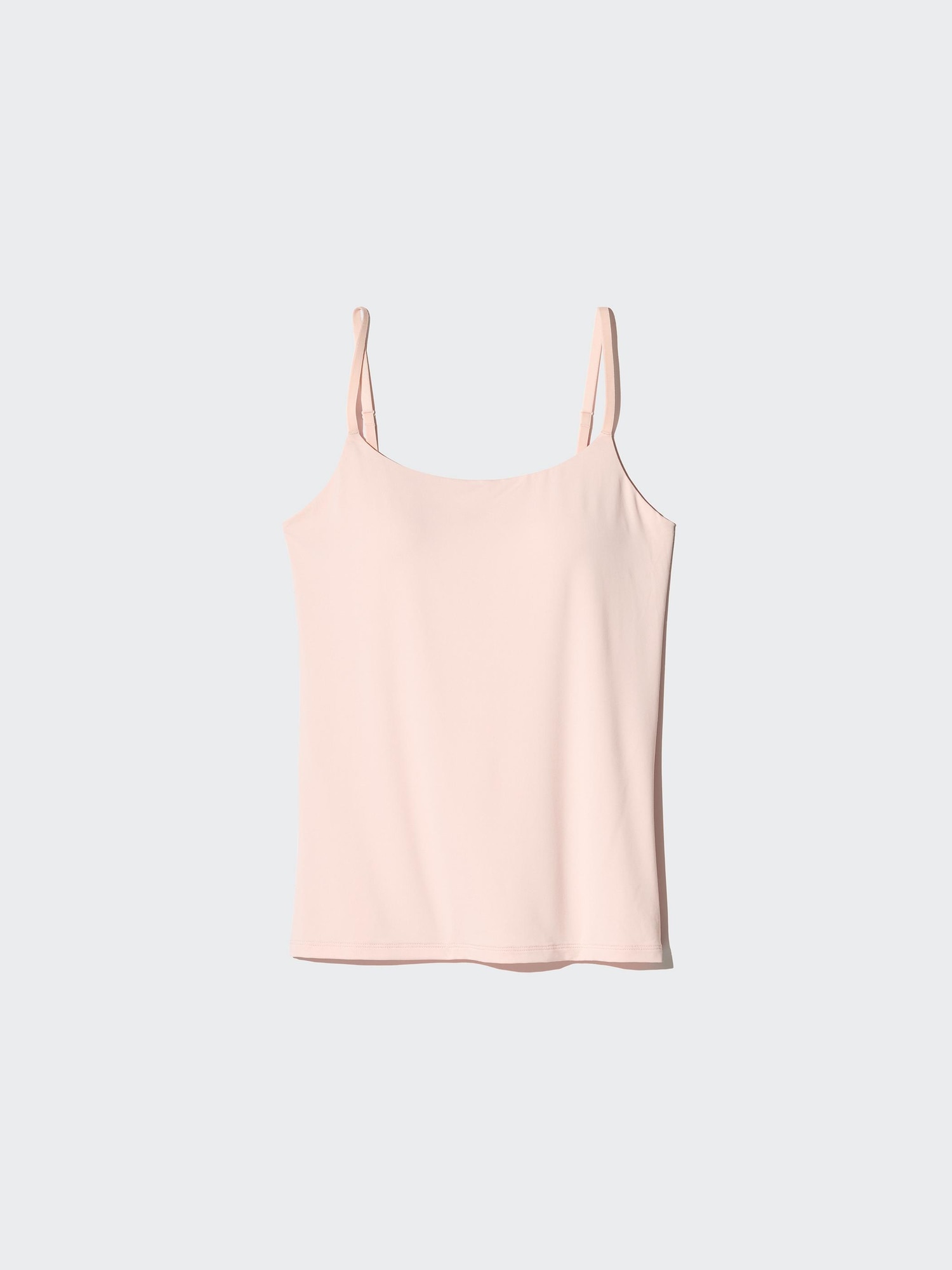 Uniqlo AIRism bra camisole in a pale pink colorway shown flat
