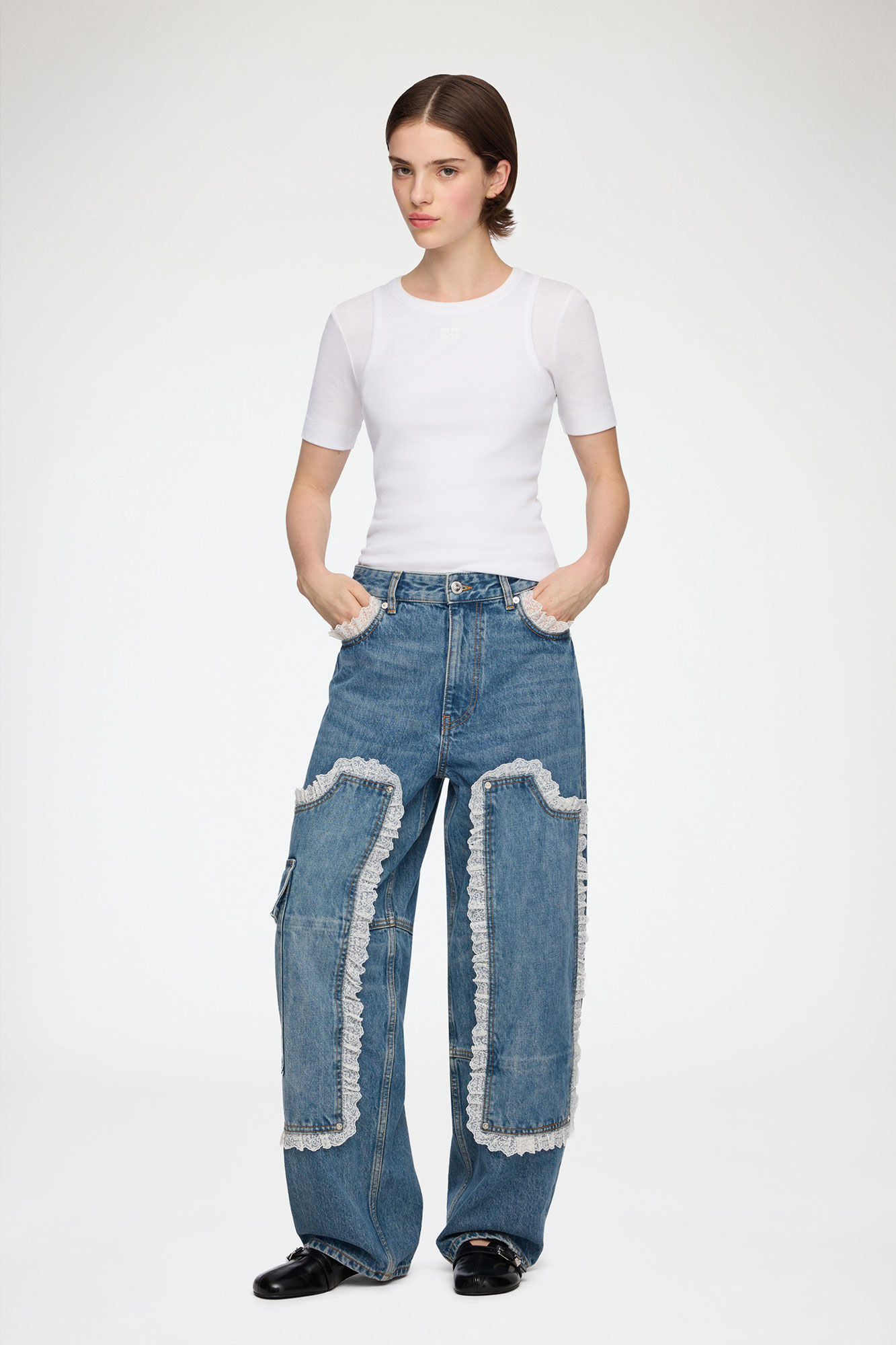 Ganni Audri lace-detail rigid denim jeans on a model
