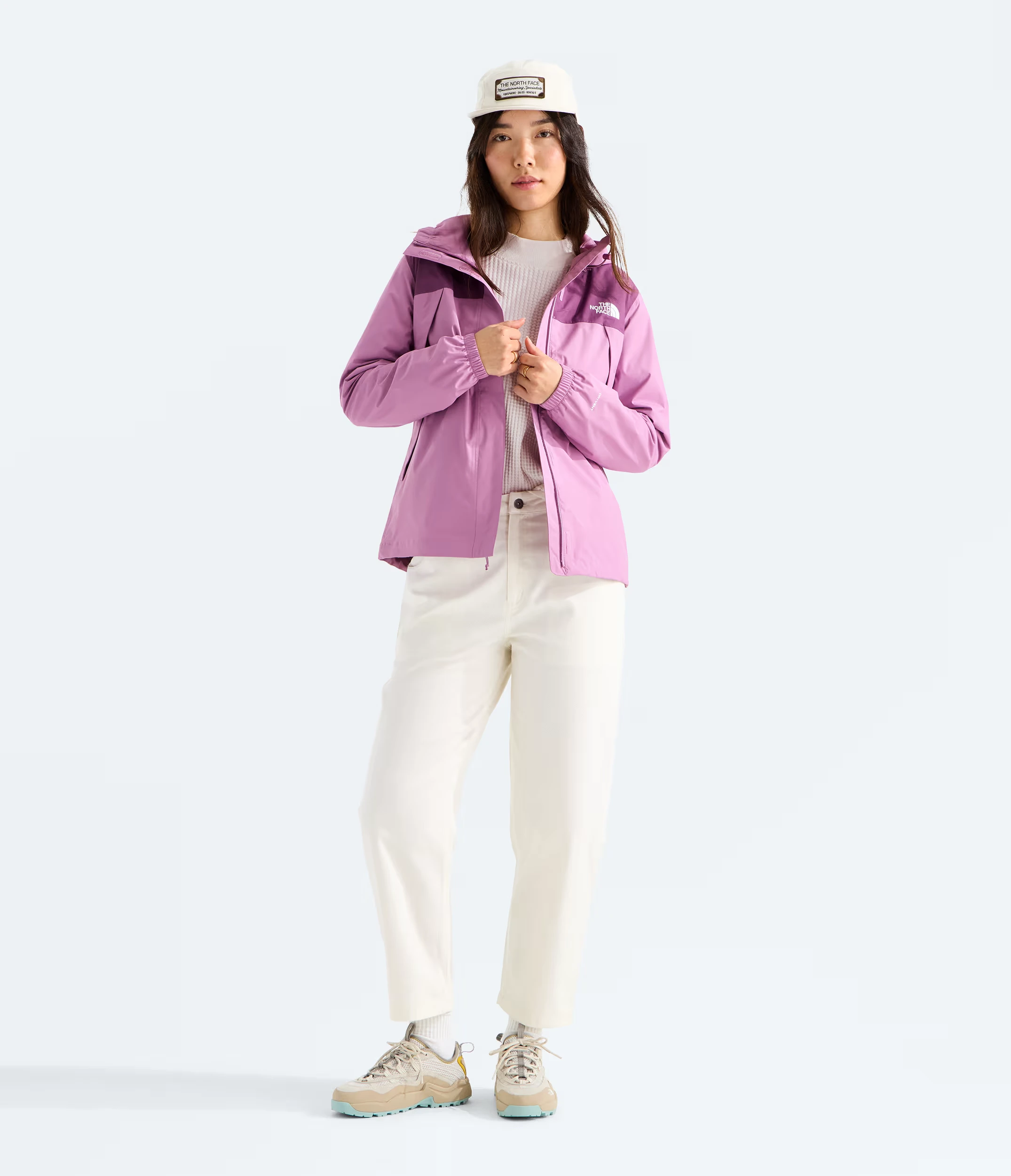 Model wearing a purple North Face women’s Antora rain jacket, style NF0A8BKDK22, shown head to shoes