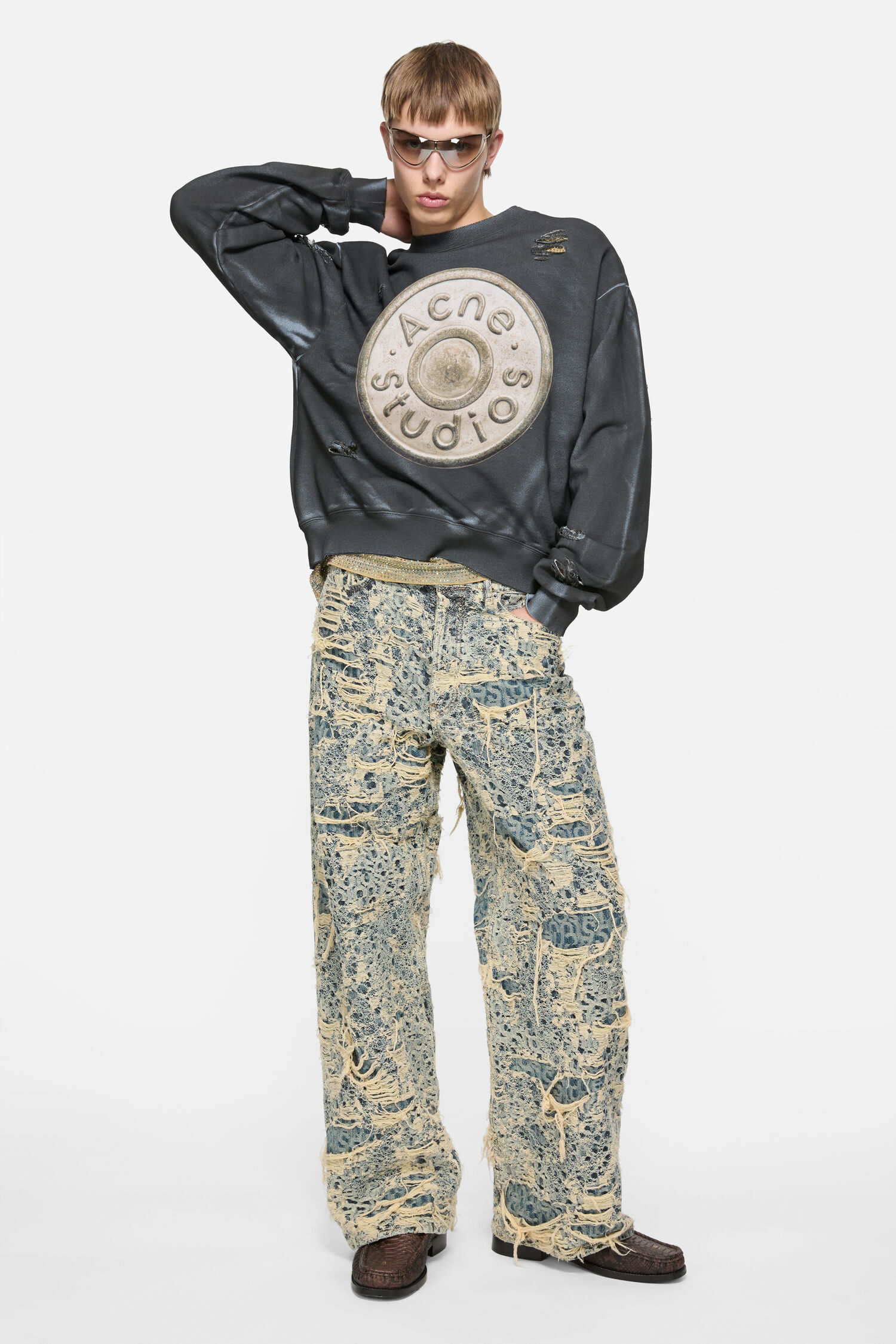Model wearing the black Acne Studios distressed logo sweatshirt