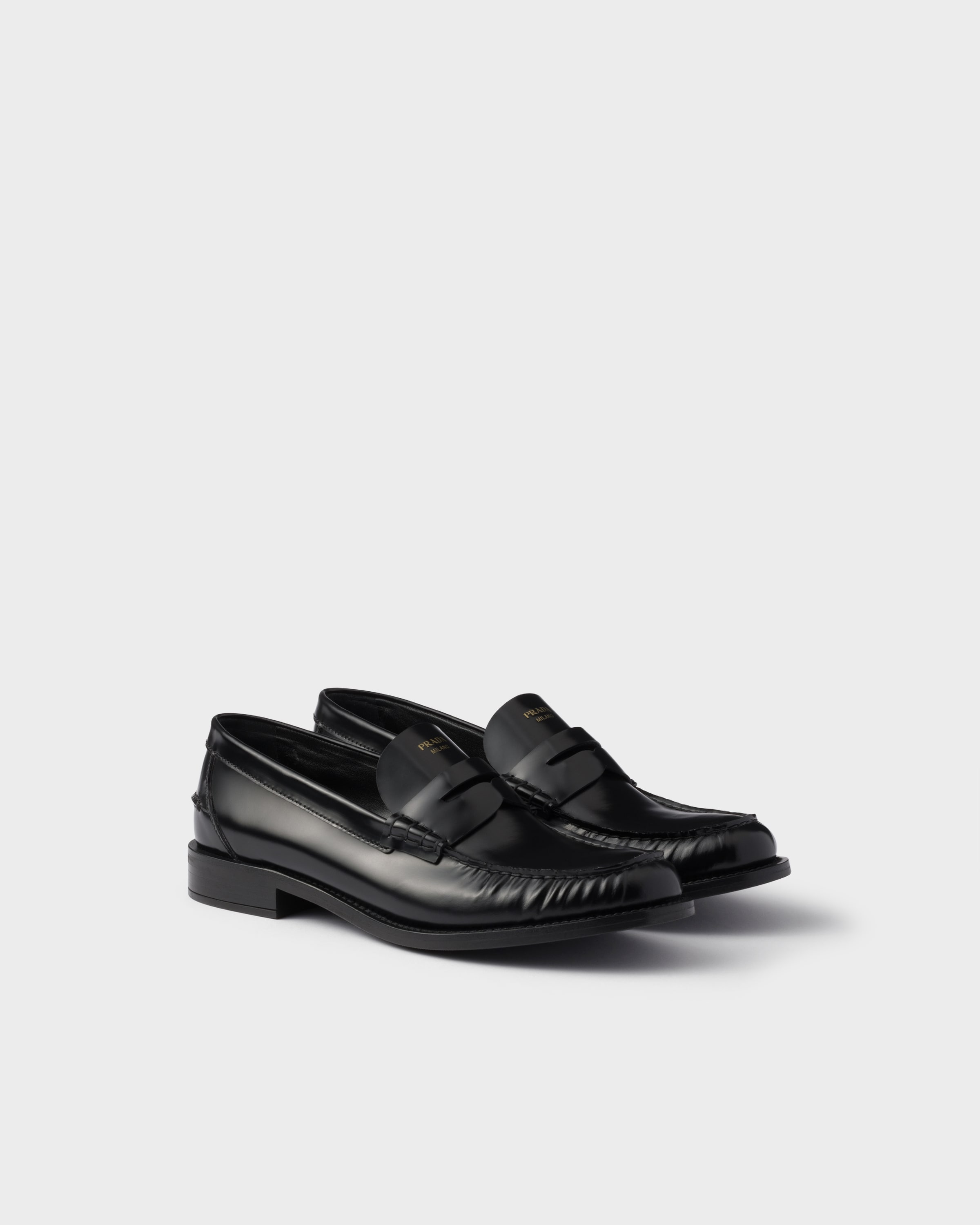 Prada Brushed leather loafers in black calfskin with leather band and low heel