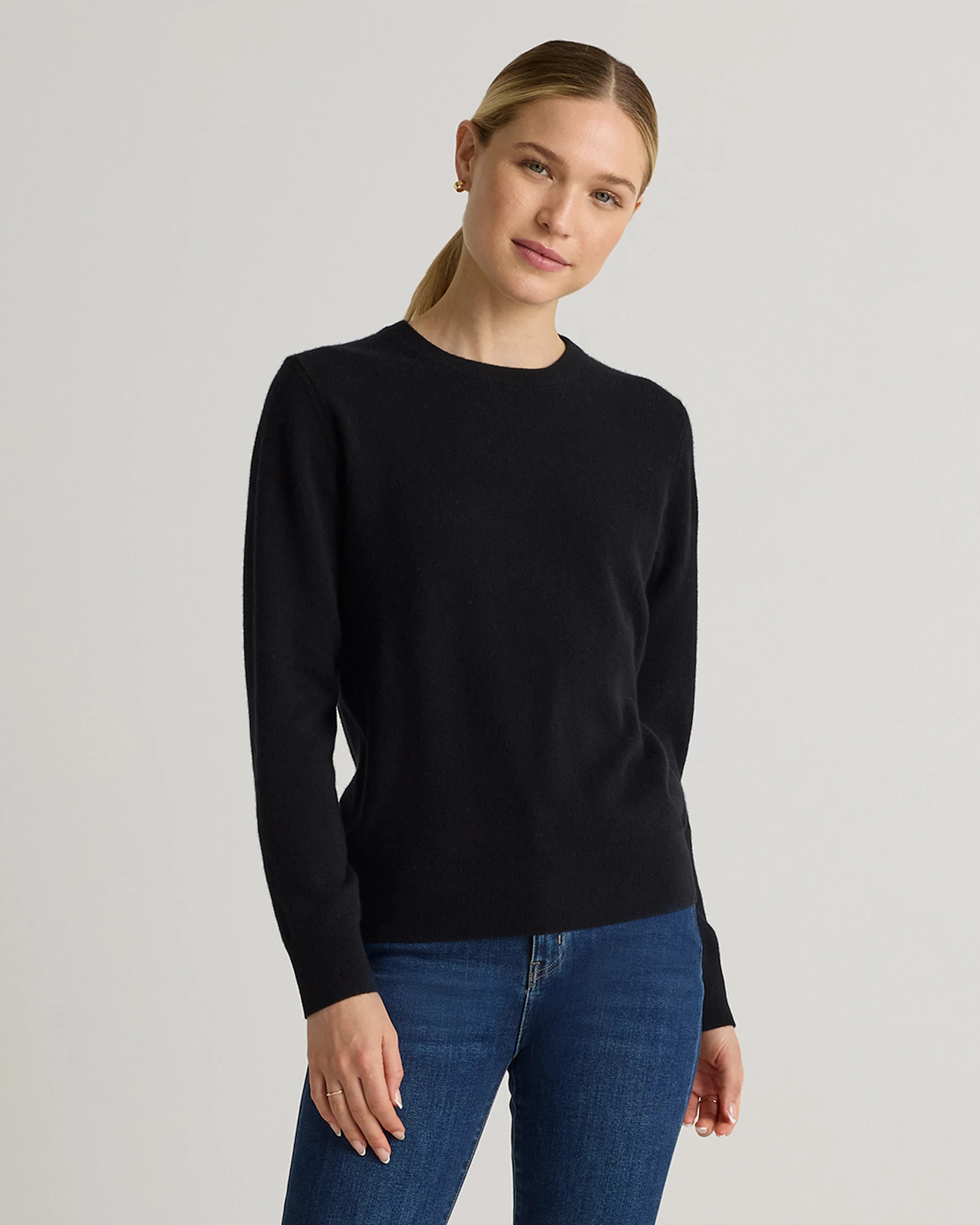 Quince Mongolian Cashmere Crewneck Sweater in Black with the full hem and both cuffs visible