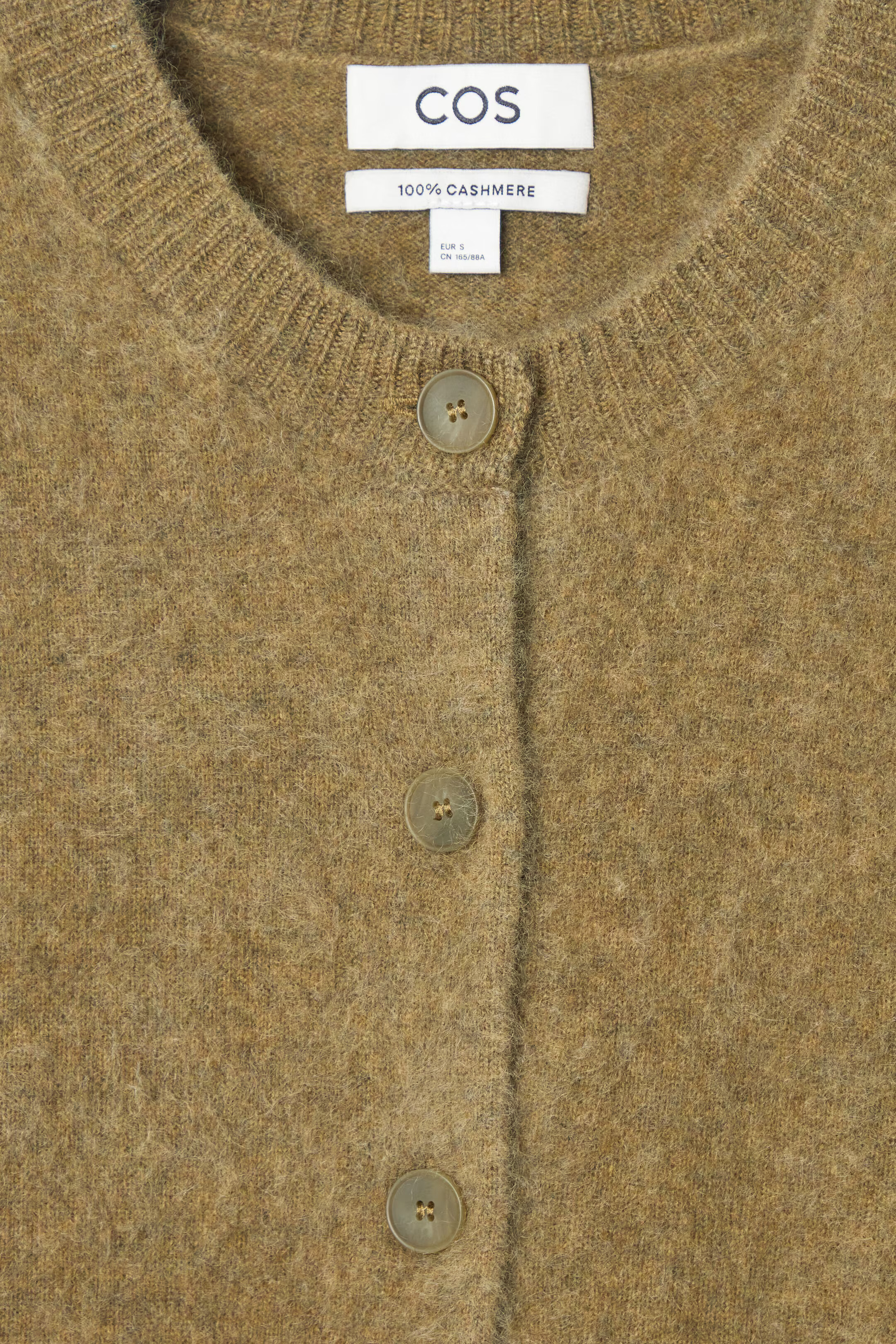 Close view of COS olive brushed cashmere cardigan neckline and buttons