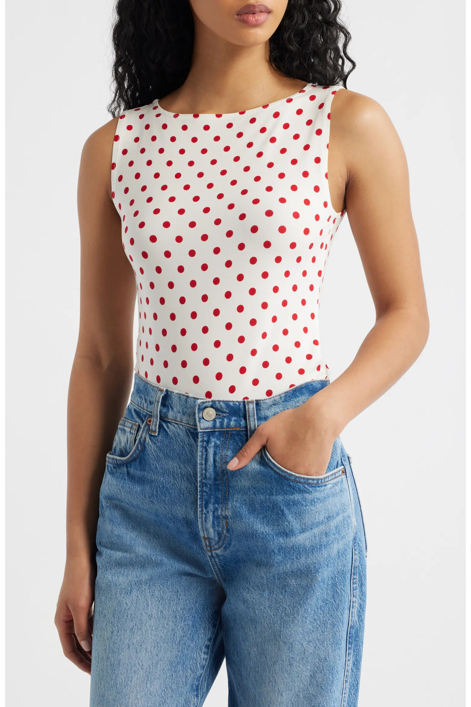 Reformation Dusk stretch knit top in the red Ketchup Dot pattern worn on a model