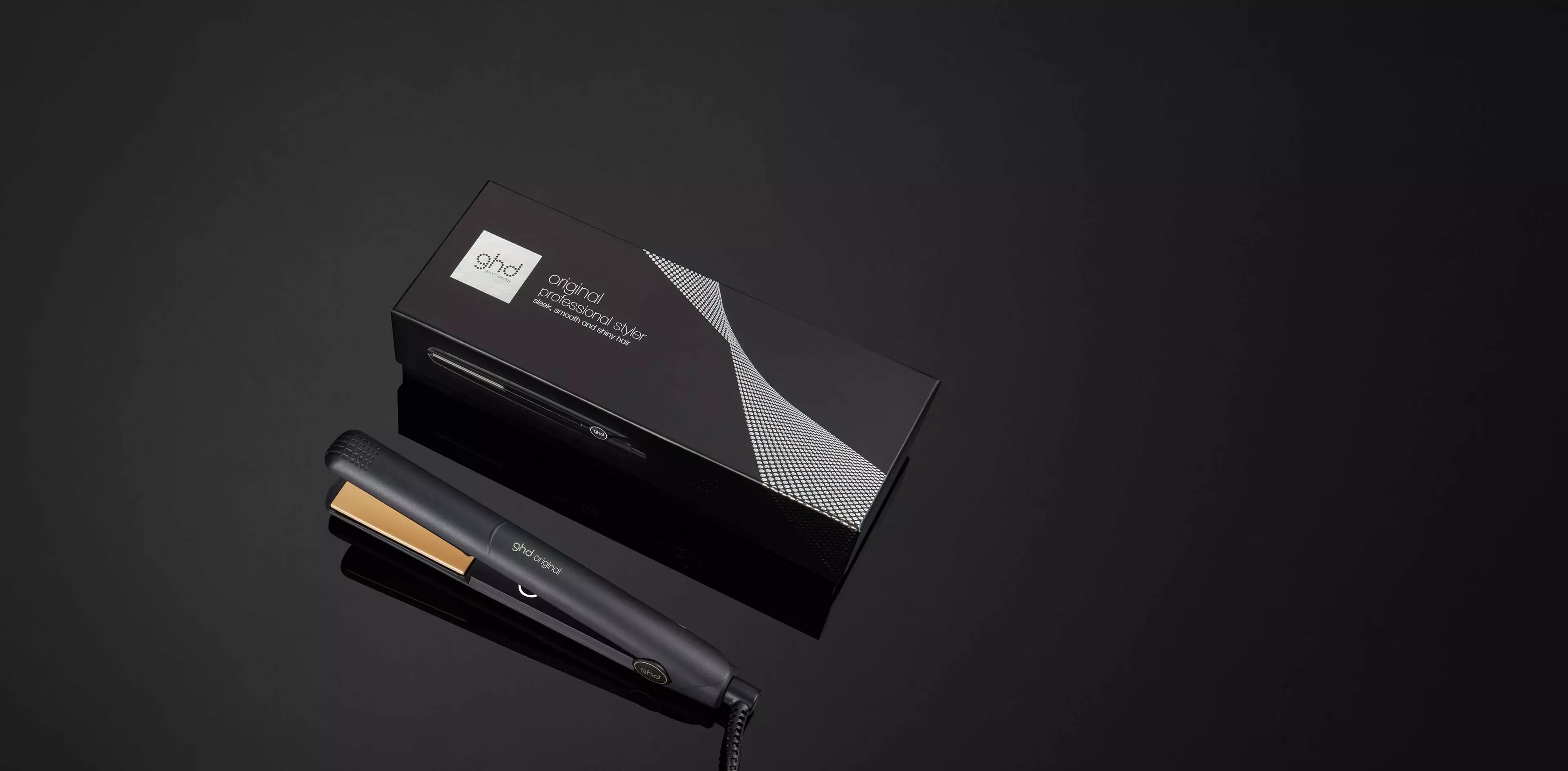 Complete black ghd Original one-inch flat iron and its box