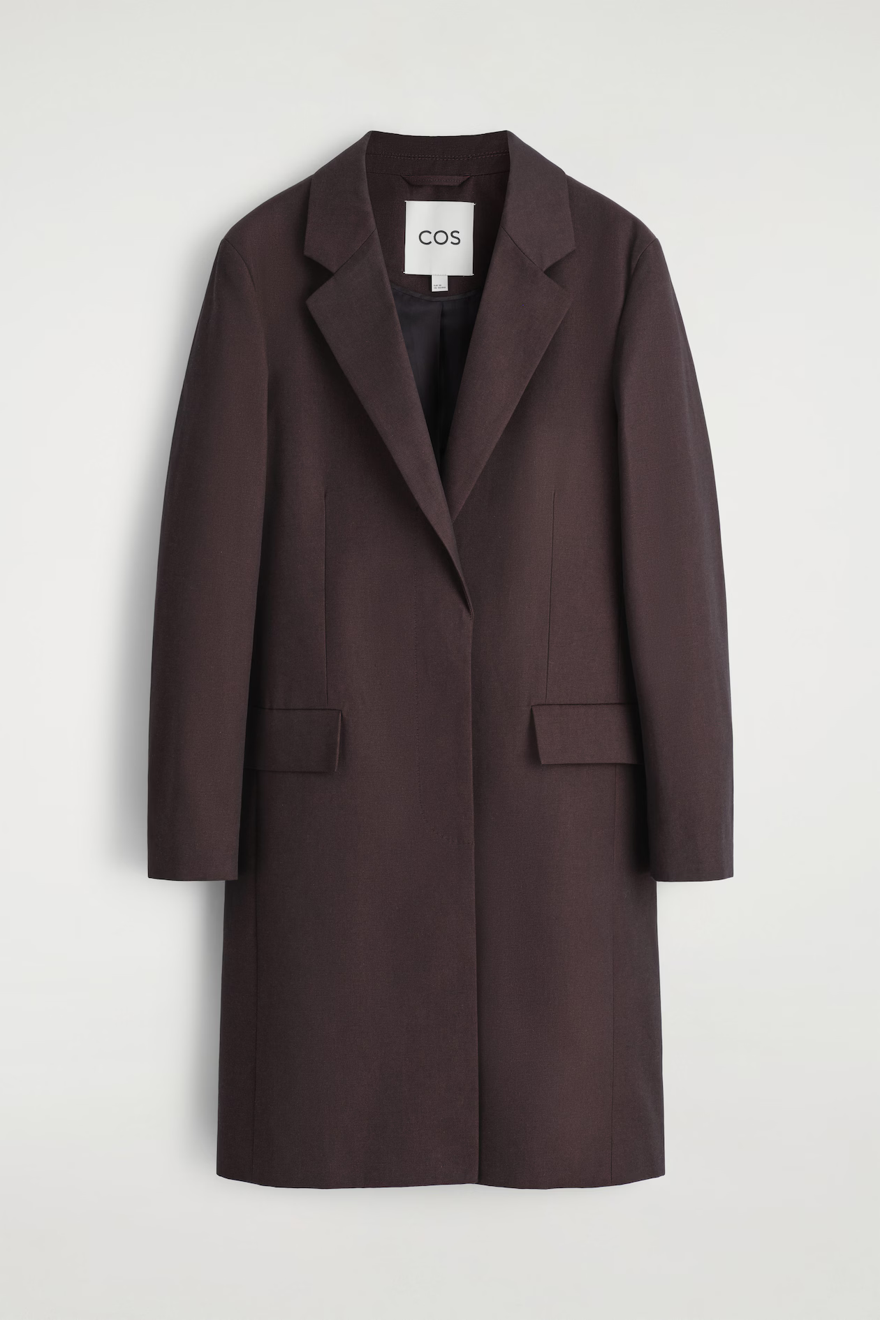 Burgundy COS tailored cotton long coat on a light background