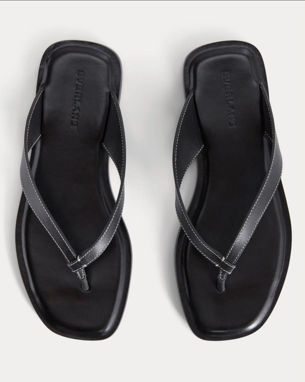 Black Everlane leather flip-flop sandals