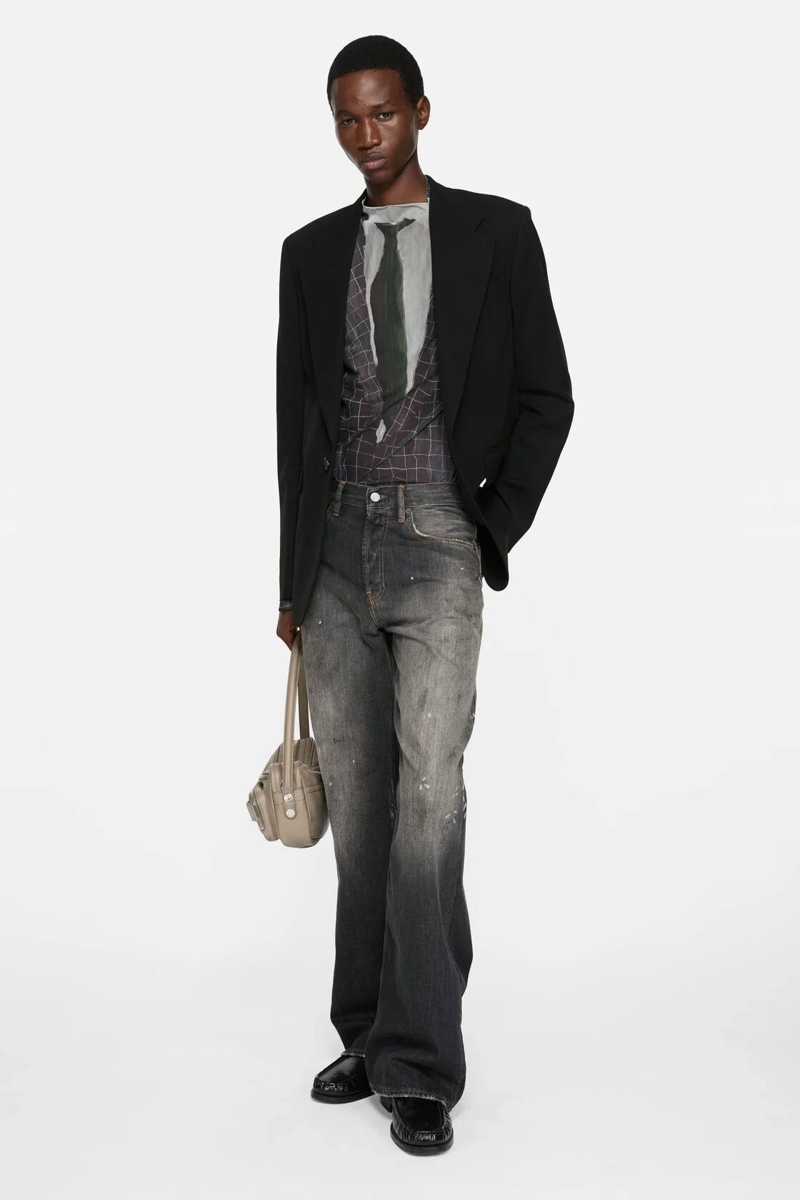 Model wearing Acne Studios 2021M Black Trafalgar wide straight jeans